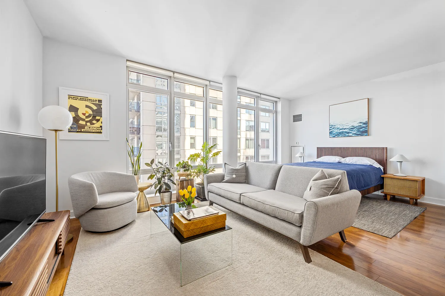 a living room with furniture and a large window