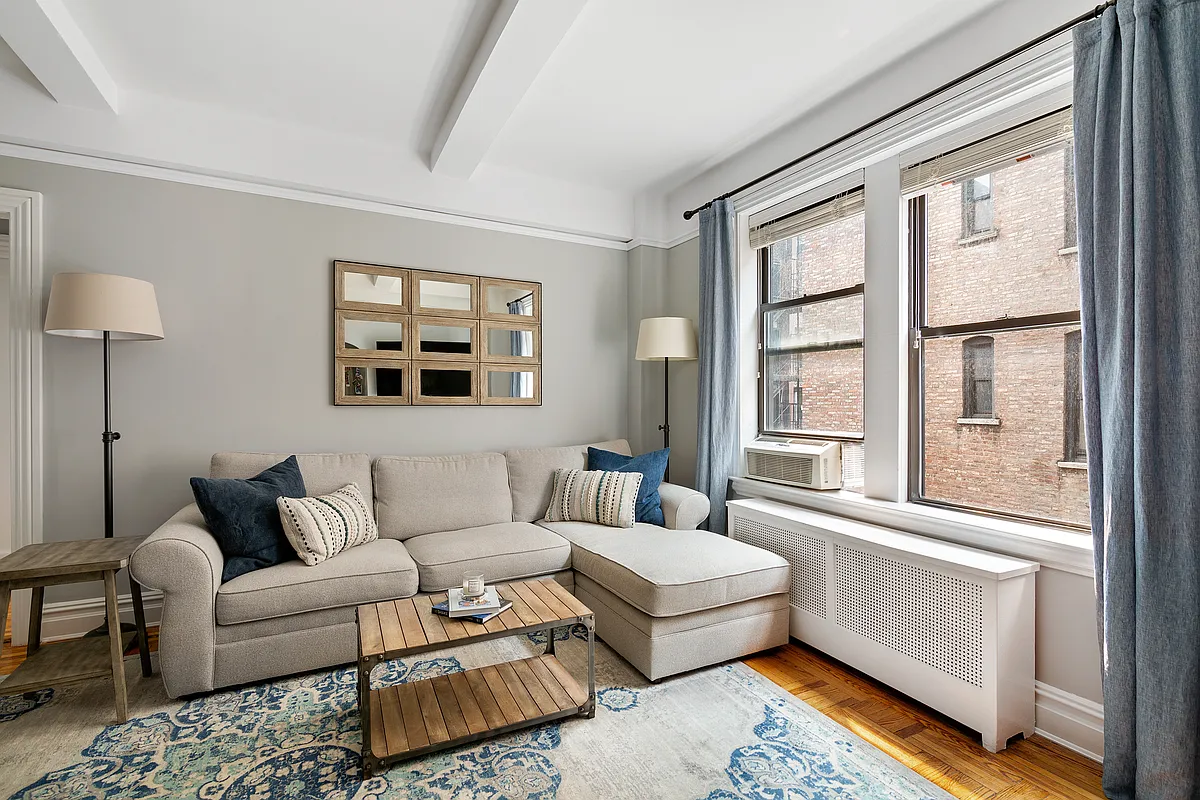 675 West End Avenue, Unit 4C Manhattan, NY 10025 - Photo 3 of 10 a living room with furniture and a window