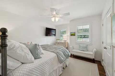 a bedroom with a bed and ceiling fan
