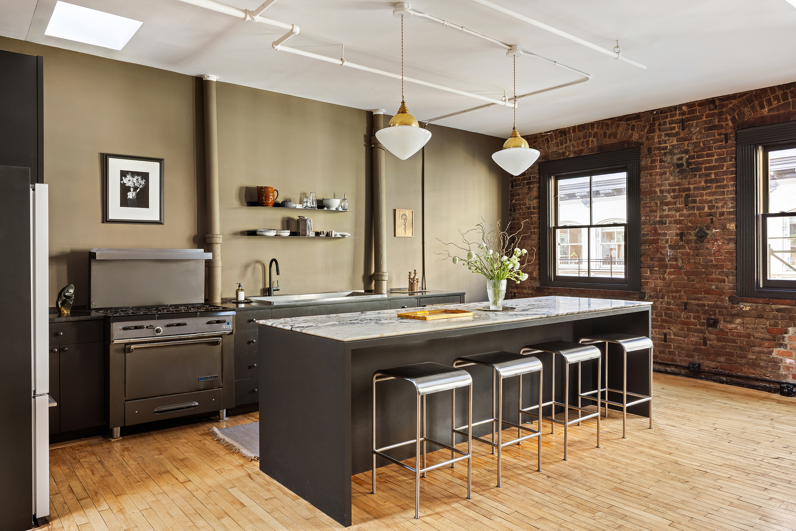 47 Howard Street, Unit PH Manhattan, NY 10013 - Photo 8 of 14 a kitchen with stainless steel appliances granite countertop a stove a sink dishwasher and a refrigerator with wooden floor