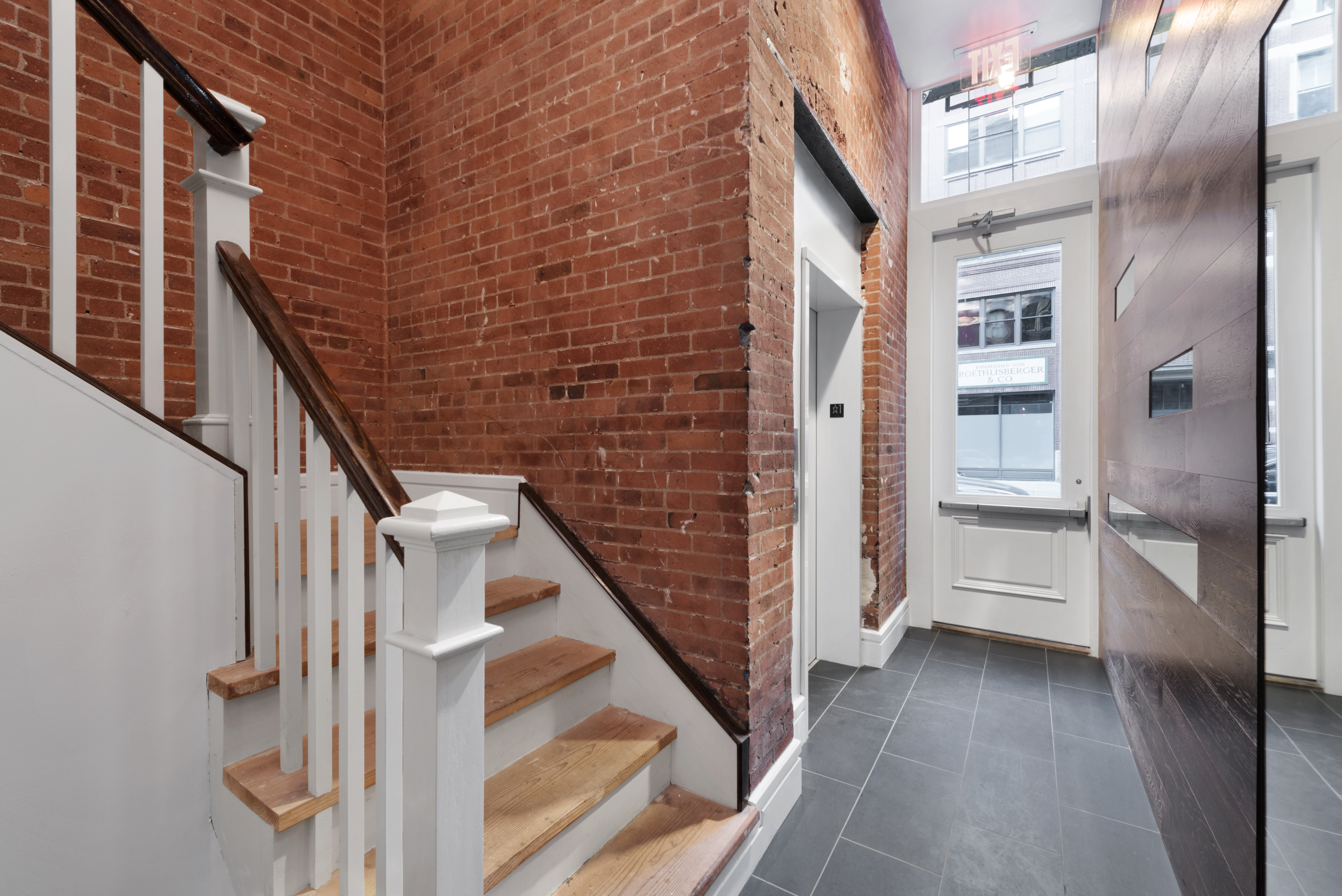 175 Franklin Street, Unit 4 Manhattan, NY 10013 - Photo 10 of 13 a view of a balcony with wooden floor and staircase