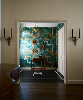 a living room with a flat screen tv and a fireplace