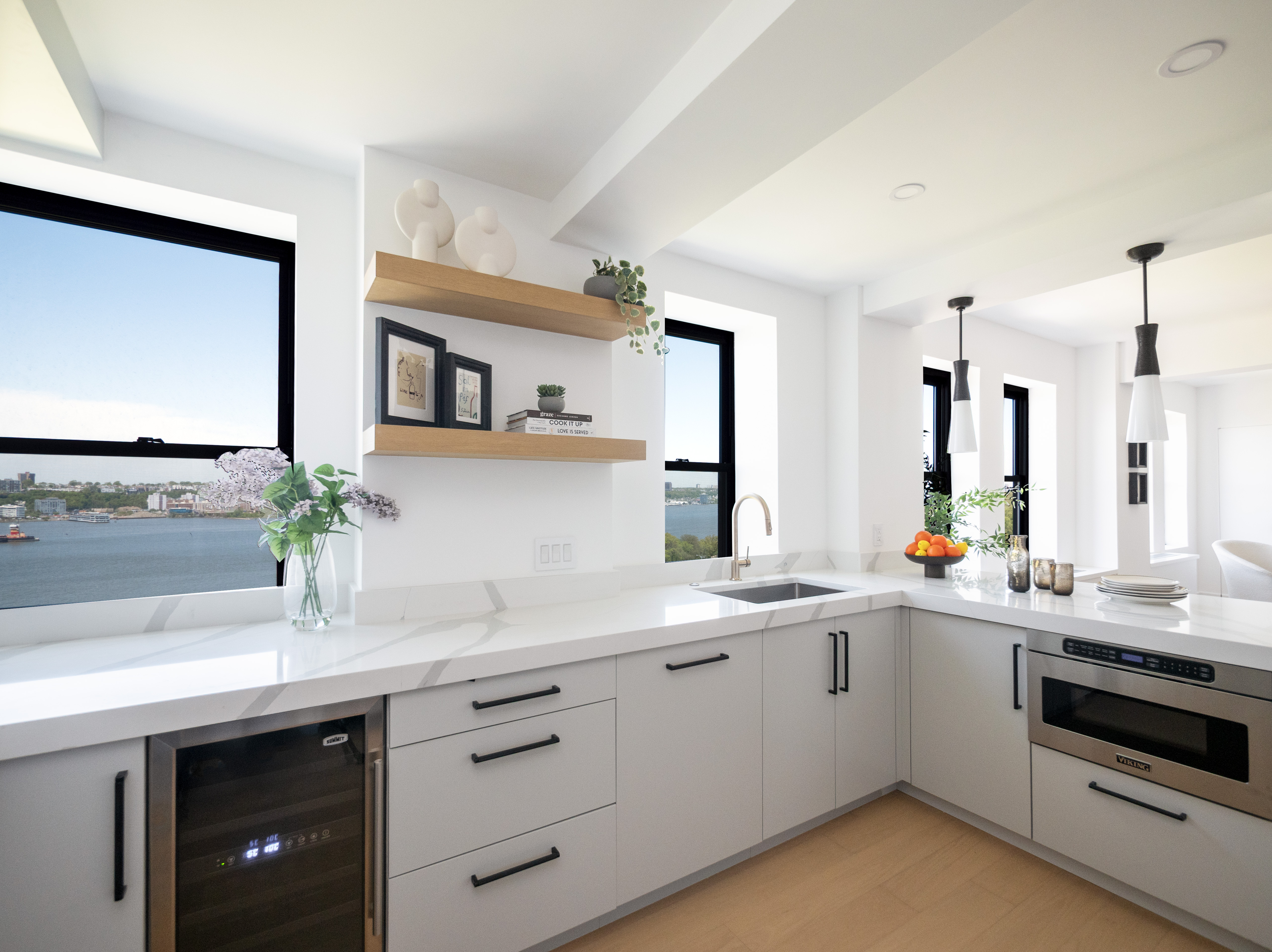 230 Riverside Drive, Unit 14AC Manhattan, NY 10025 - Photo 8 of 30 a kitchen with a sink dishwasher and white cabinets