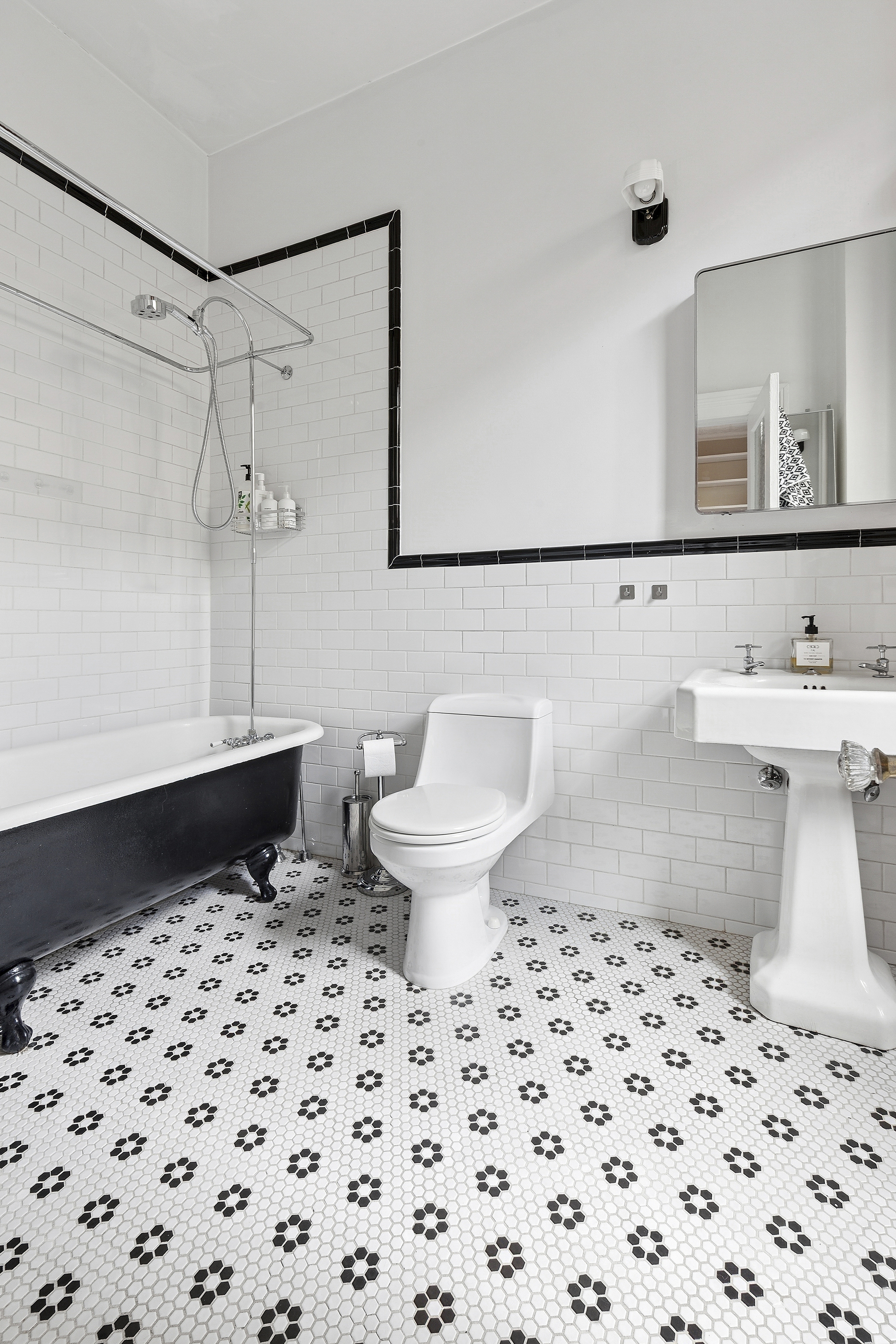 111 North 8th Street, Unit 1 Brooklyn, NY 11249 - Photo 5 of 5 a bathroom with a sink a toilet and a mirror