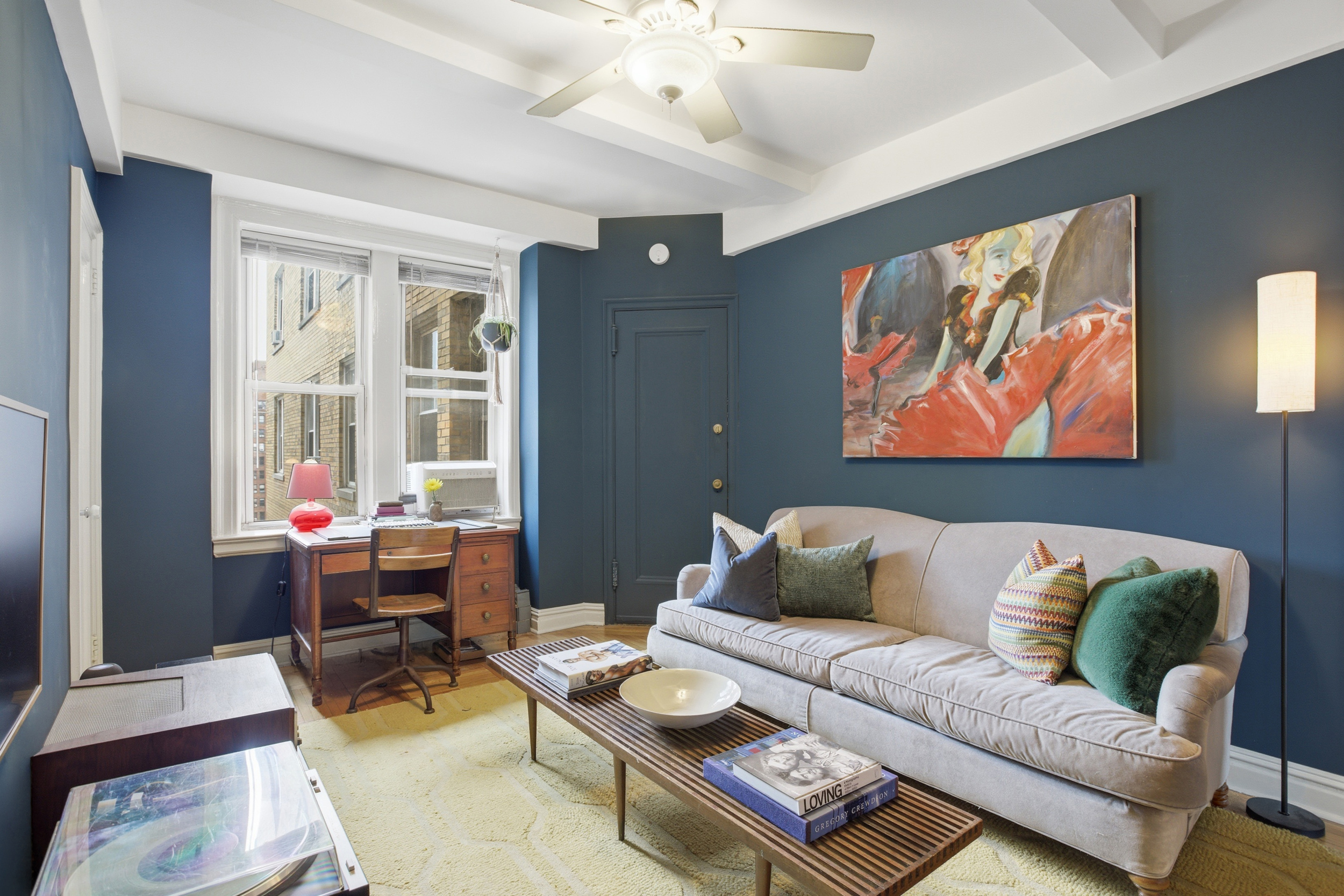 245 West 104th Street, Unit 14C Manhattan, NY 10025 - Photo 11 of 13 a living room with furniture and wooden floor