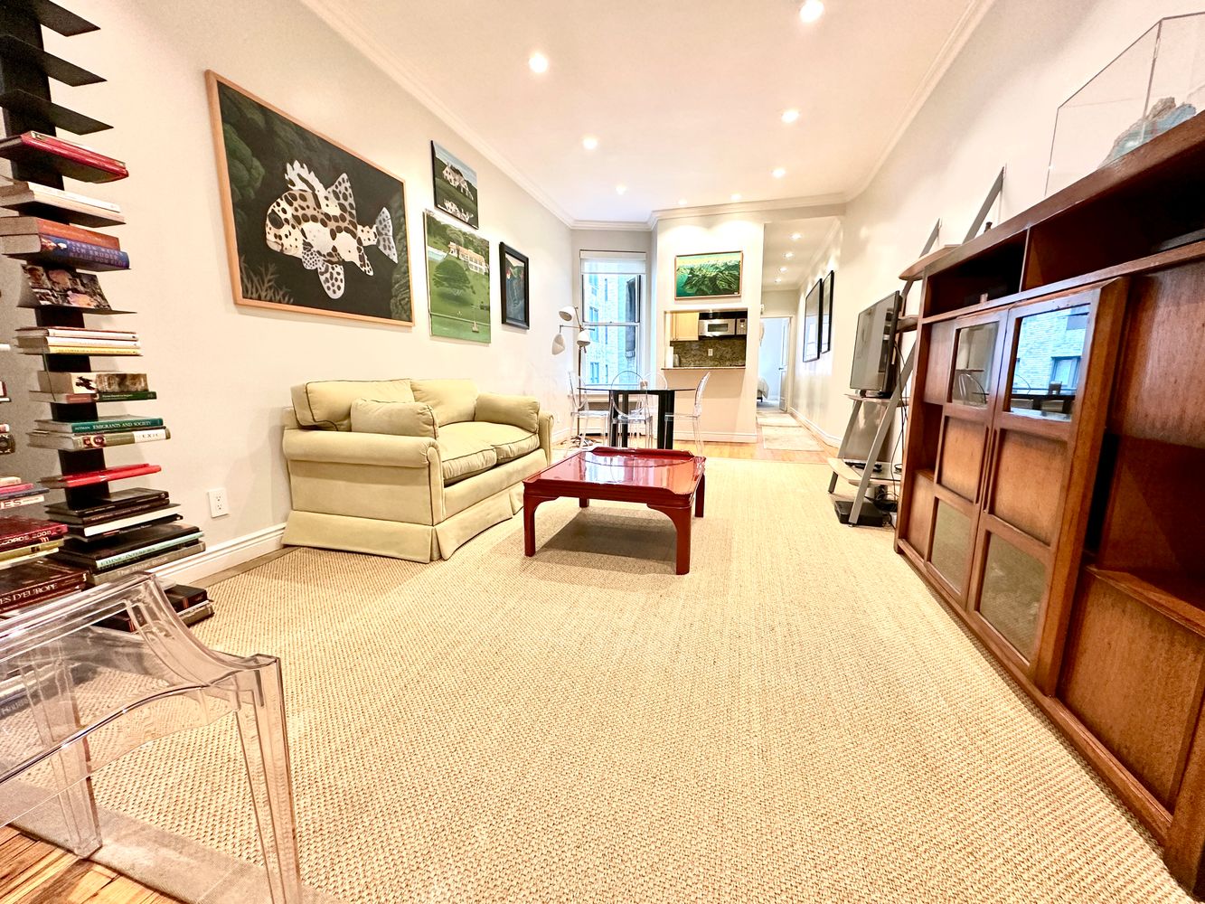 a bedroom with furniture and a book shelf