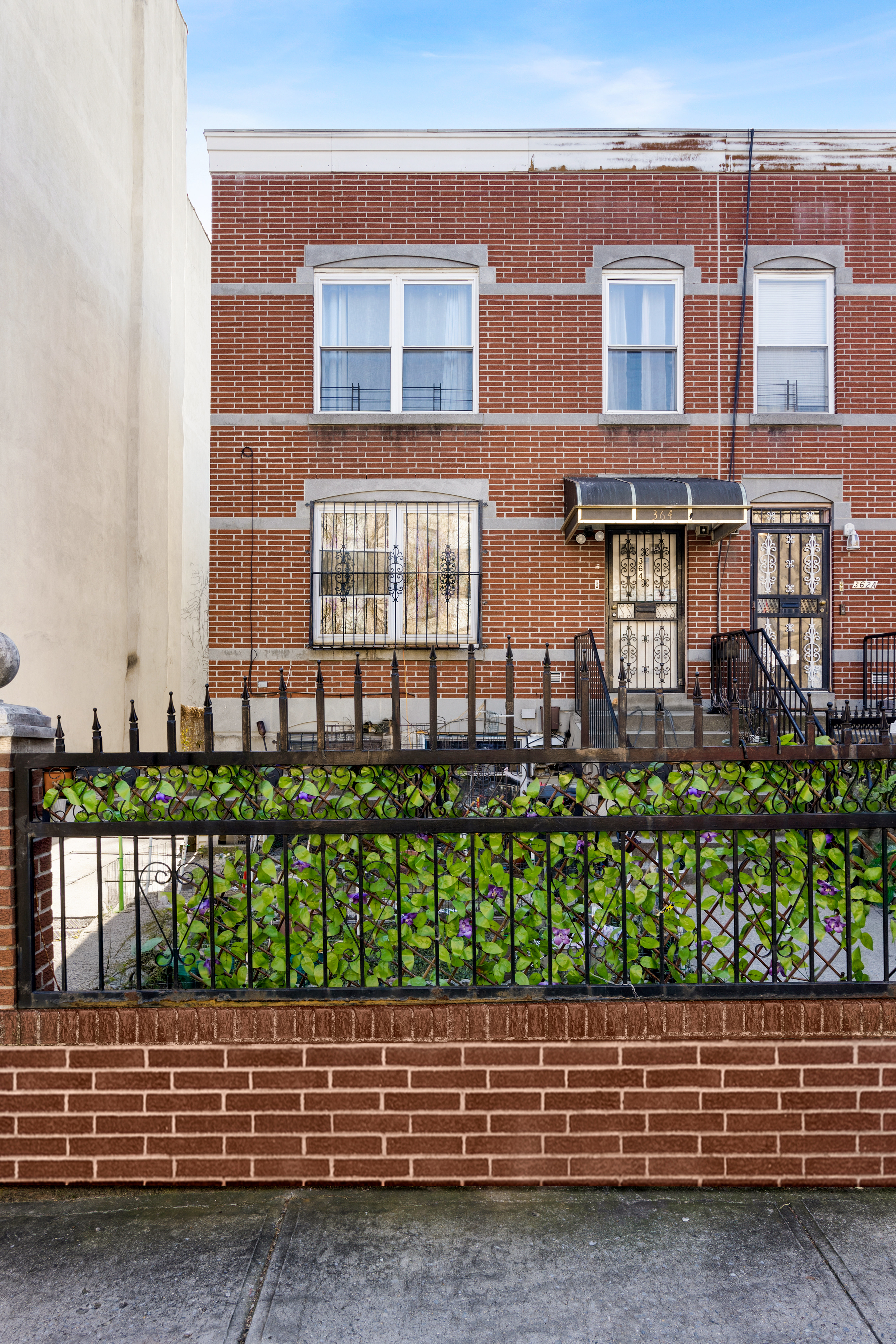 364 Chauncey Street Brooklyn, NY 11233 - Photo 2 of 17 a view of a brick house with a yard