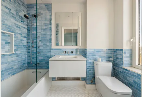 a bathroom with a sink a toilet and bathtub