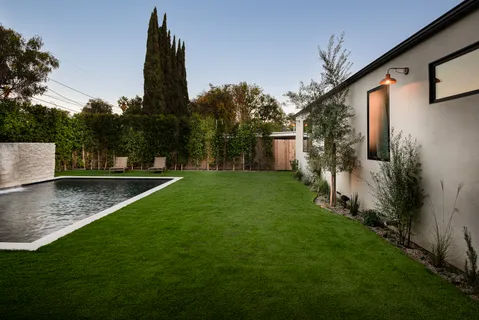 a bathroom with a granite countertop sink mirror and double