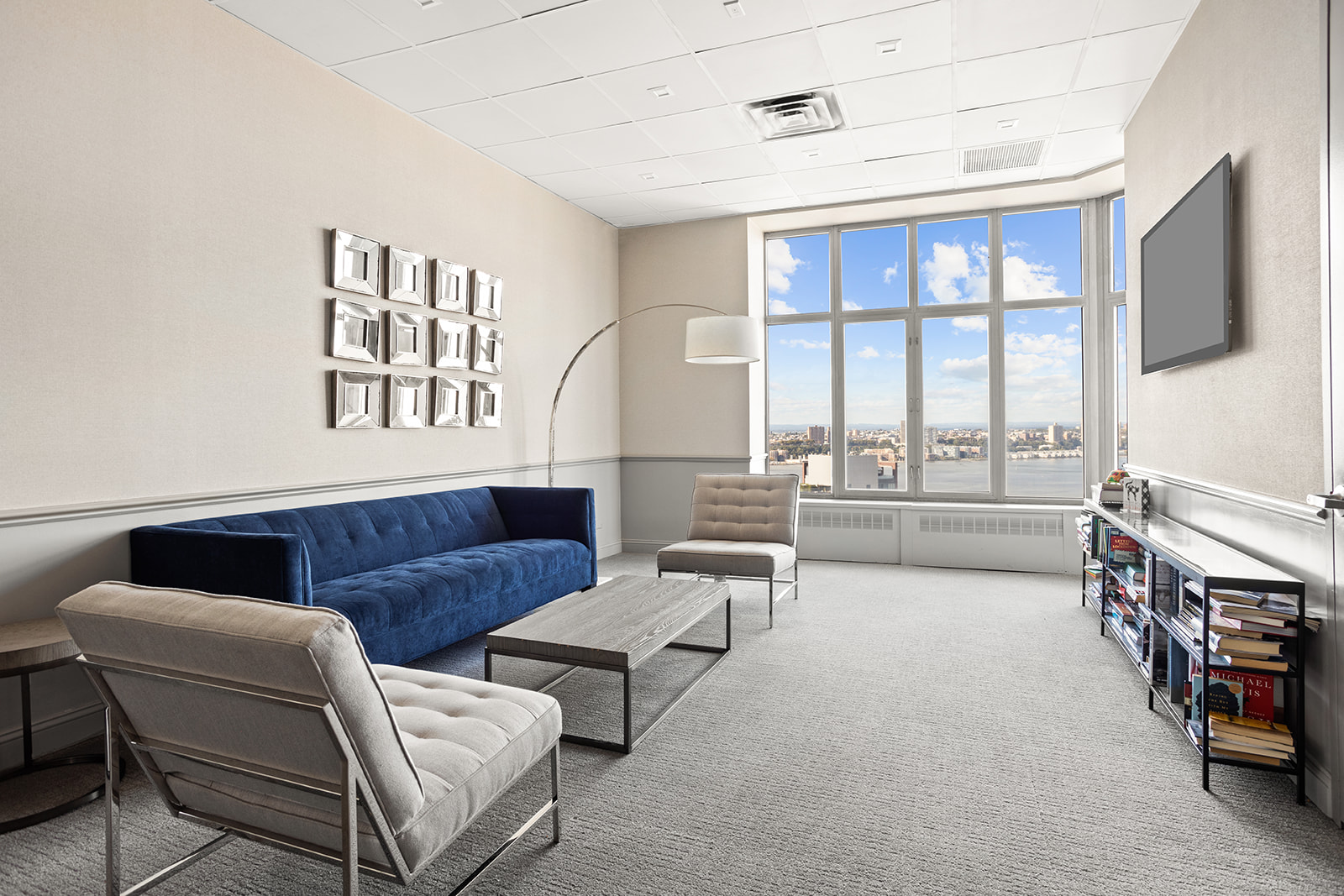 500 West 43rd Street, Unit 3B Manhattan, NY 10036 - Photo 17 of 19 a living room with furniture and a flat screen tv