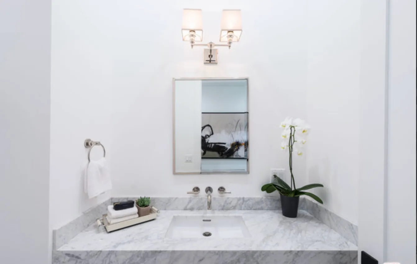 a bathroom with a sink and a mirror