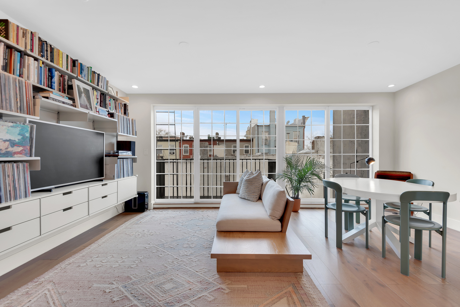 541 Madison Street, Unit 4 Brooklyn, NY 11221 - Photo 4 of 9 a living room with furniture a flat screen tv and a flat screen tv