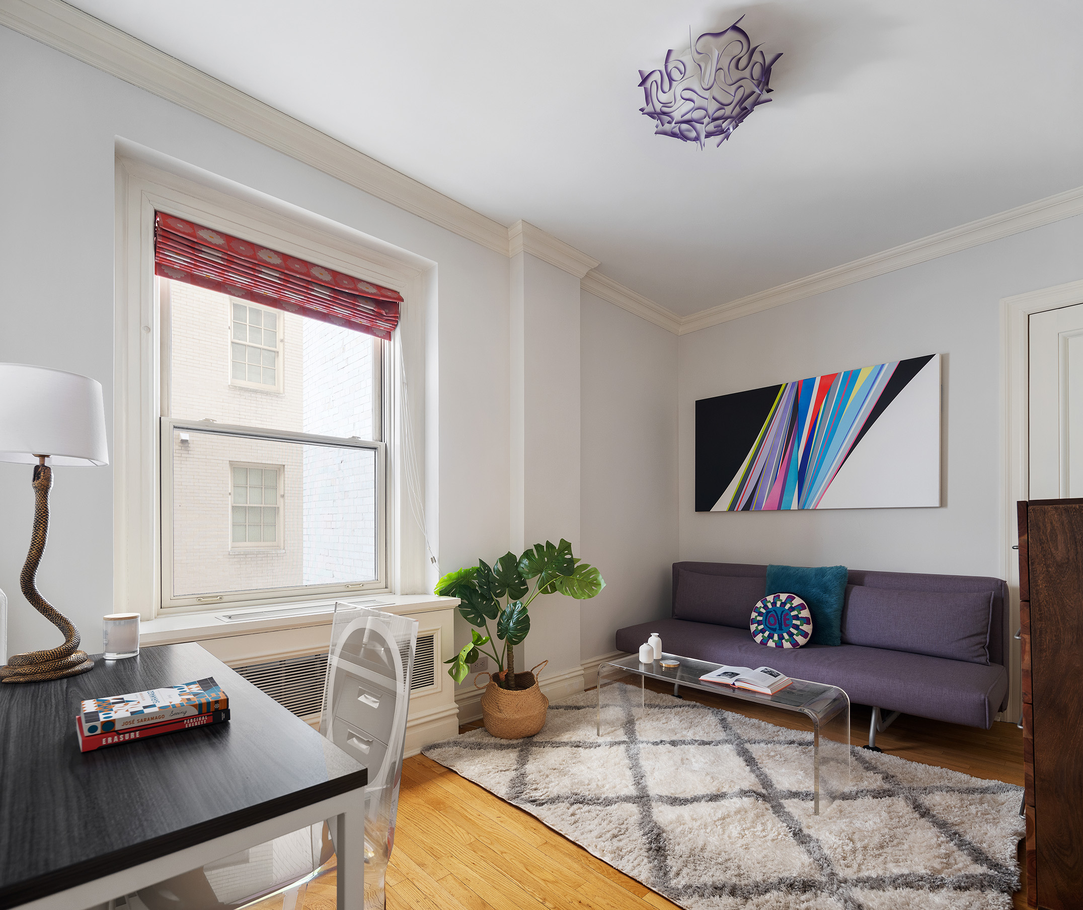 829 Park Avenue, Unit 2/3D Manhattan, NY 10021 - Photo 7 of 18 a living room with furniture and a potted plant