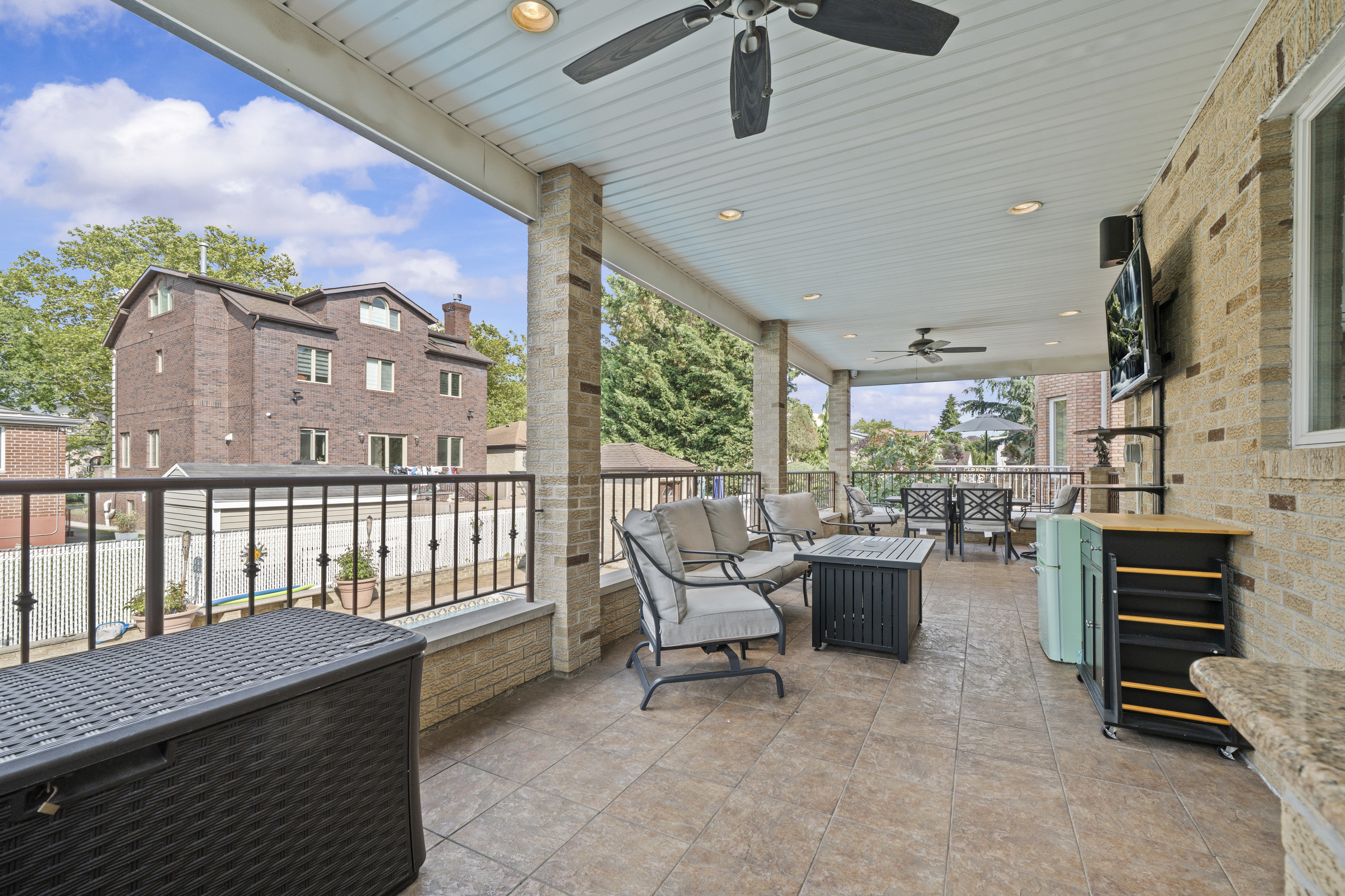 2253 East 64th Street Brooklyn, NY 11234 - Photo 36 of 45 a living room with furniture and a floor to ceiling window