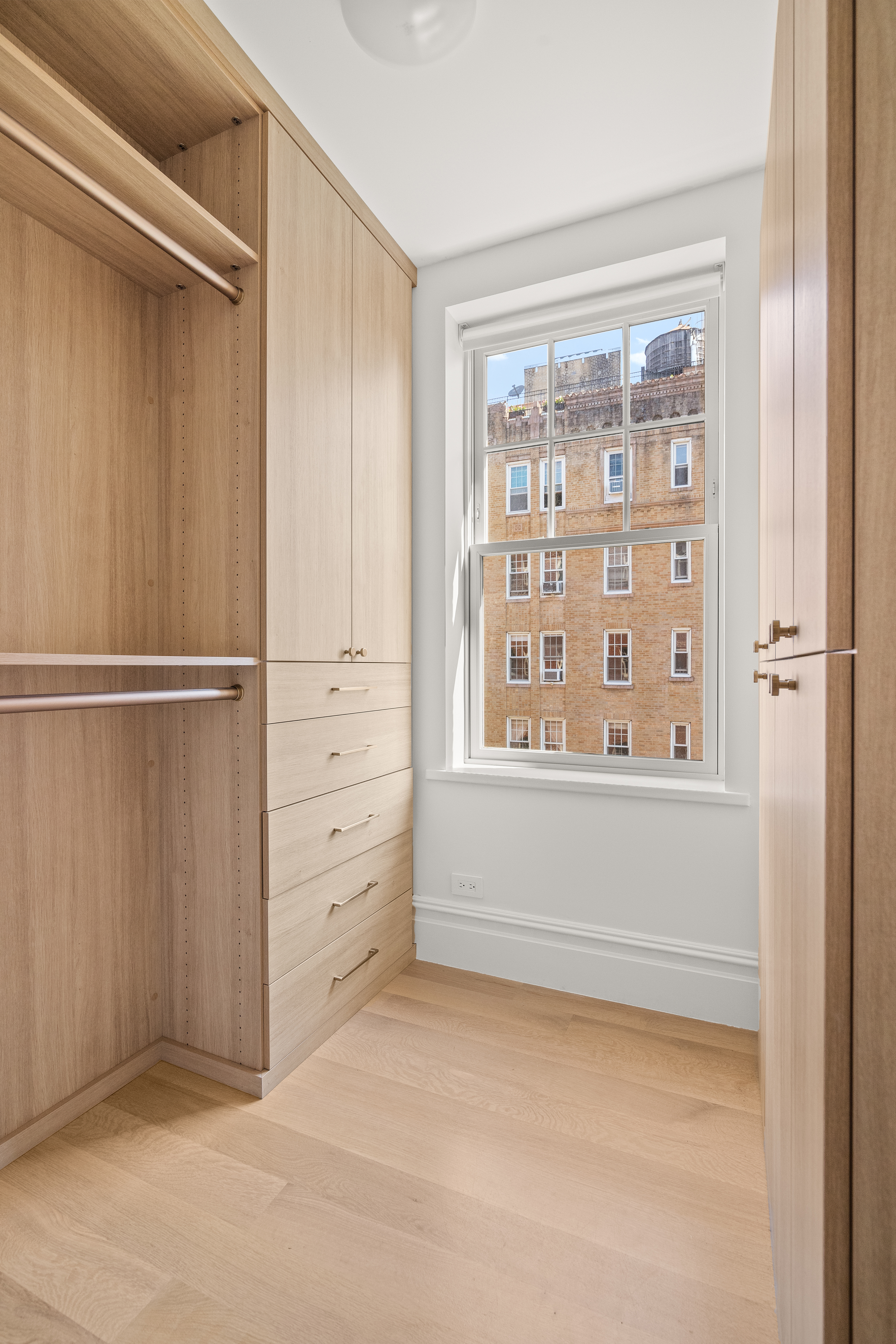 150 West 82nd Street, Unit 7A Manhattan, NY 10024 - Photo 7 of 15 a view of an empty room with a window