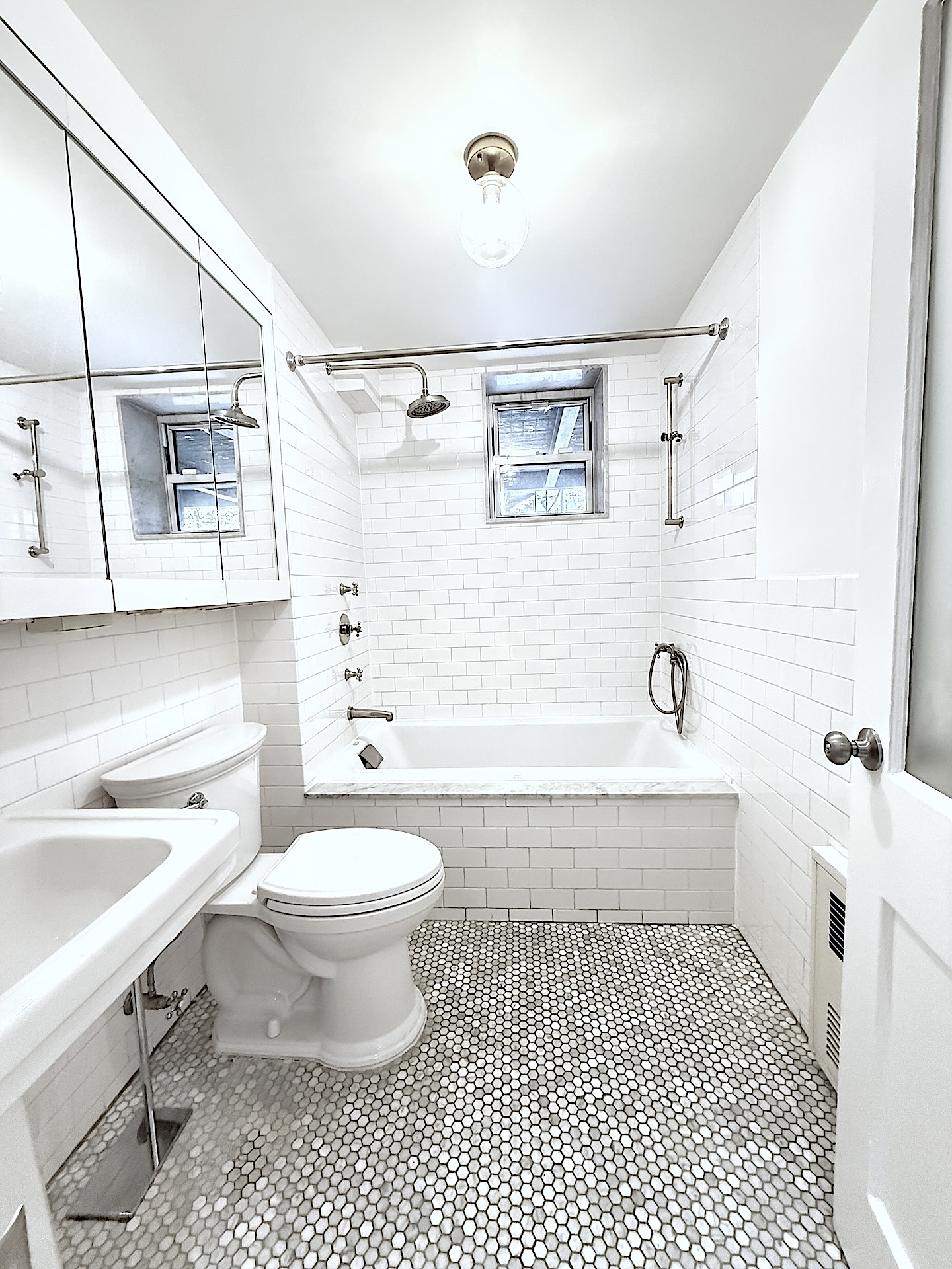 424 Pacific Street, Unit GARDEN Brooklyn, NY 11217 - Photo 10 of 16 a bathroom with a sink a toilet and shower