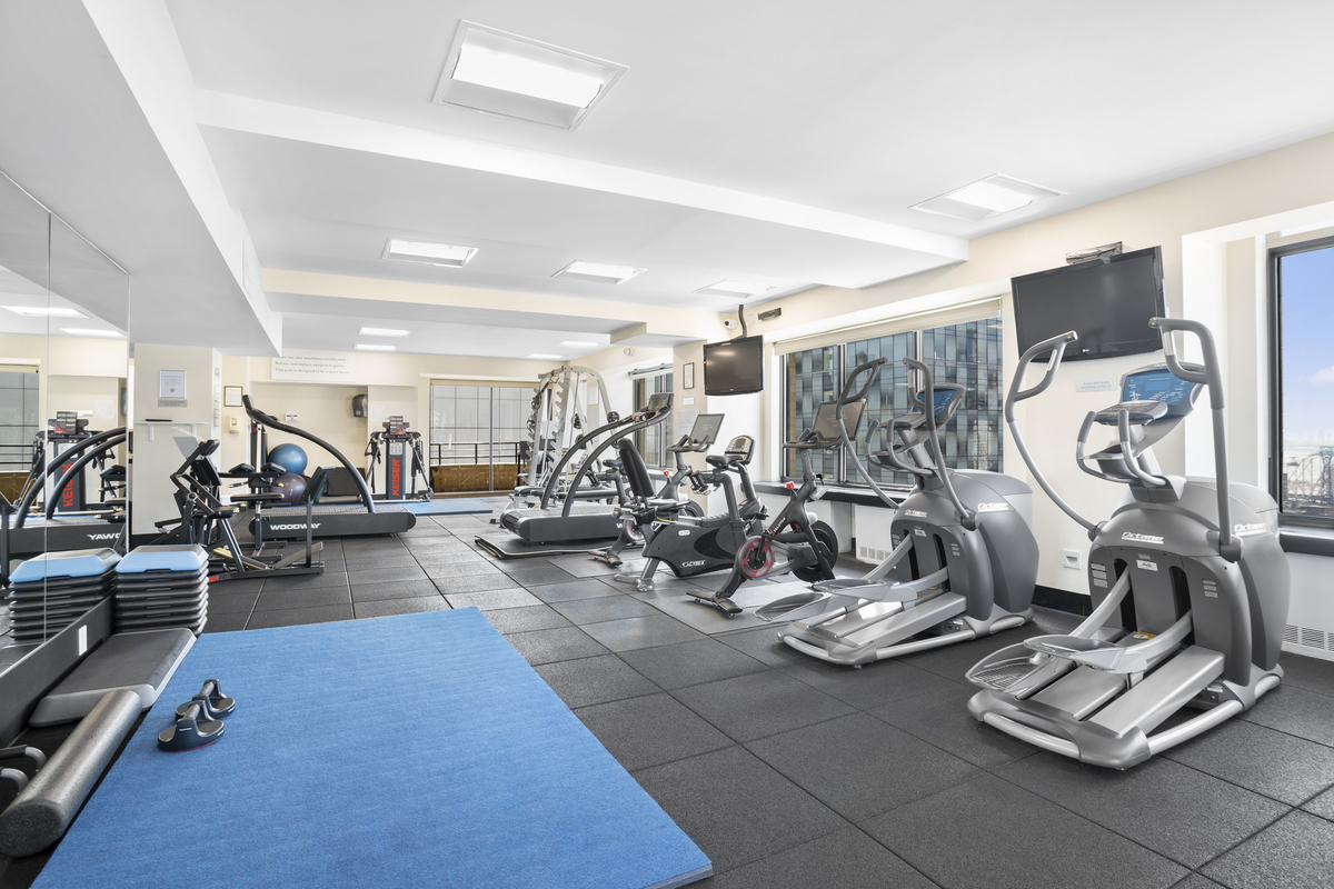 400 East 70th Street, Unit 3301 Manhattan, NY 10021 - Photo 19 of 20 a view of a room with gym equipment