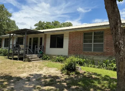 a view of house with yard
