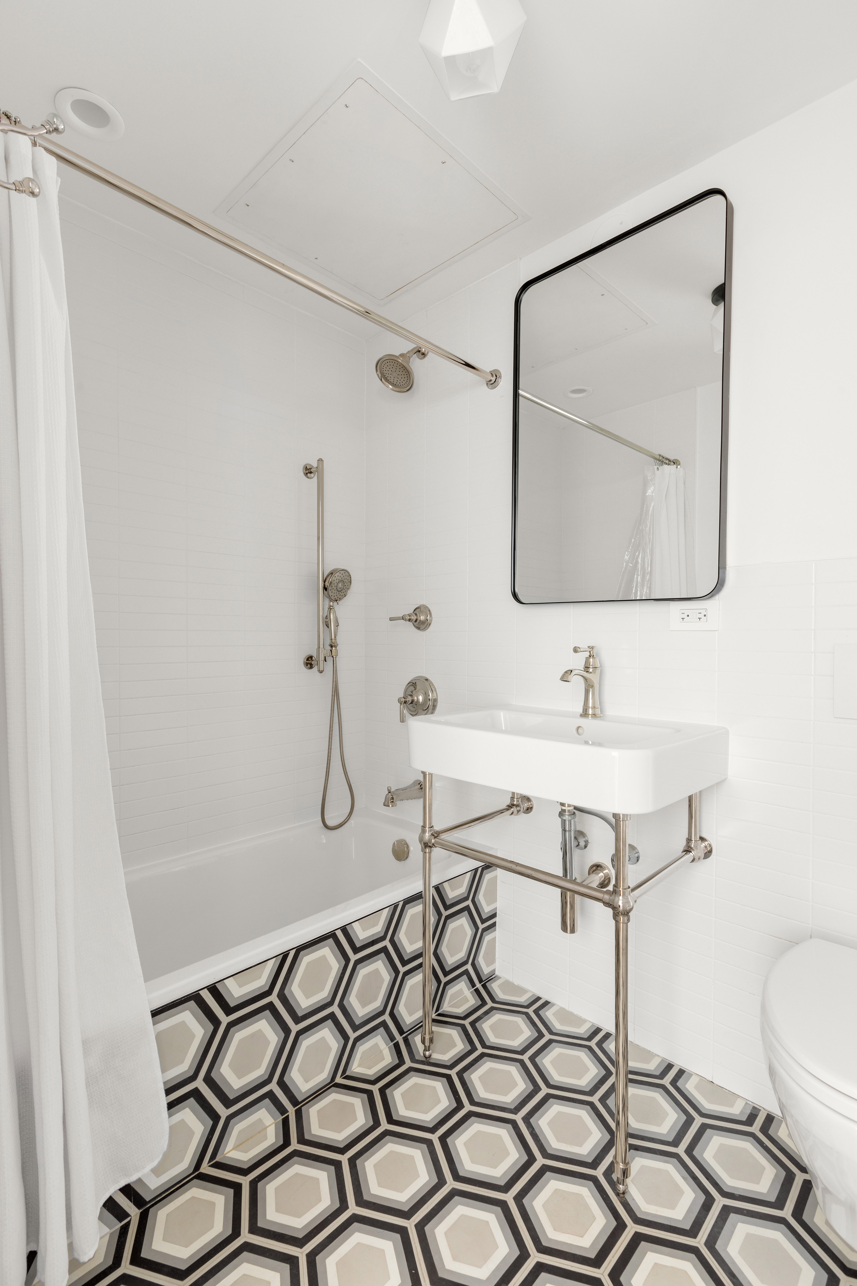 352 6th Avenue, Unit 3 Brooklyn, NY 11215 - Photo 11 of 14 a bathroom with a sink toilet and shower