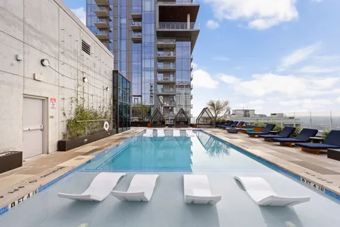 a view of a swimming pool with a lounge chair