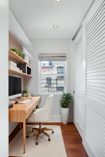 a workspace with furniture and a window