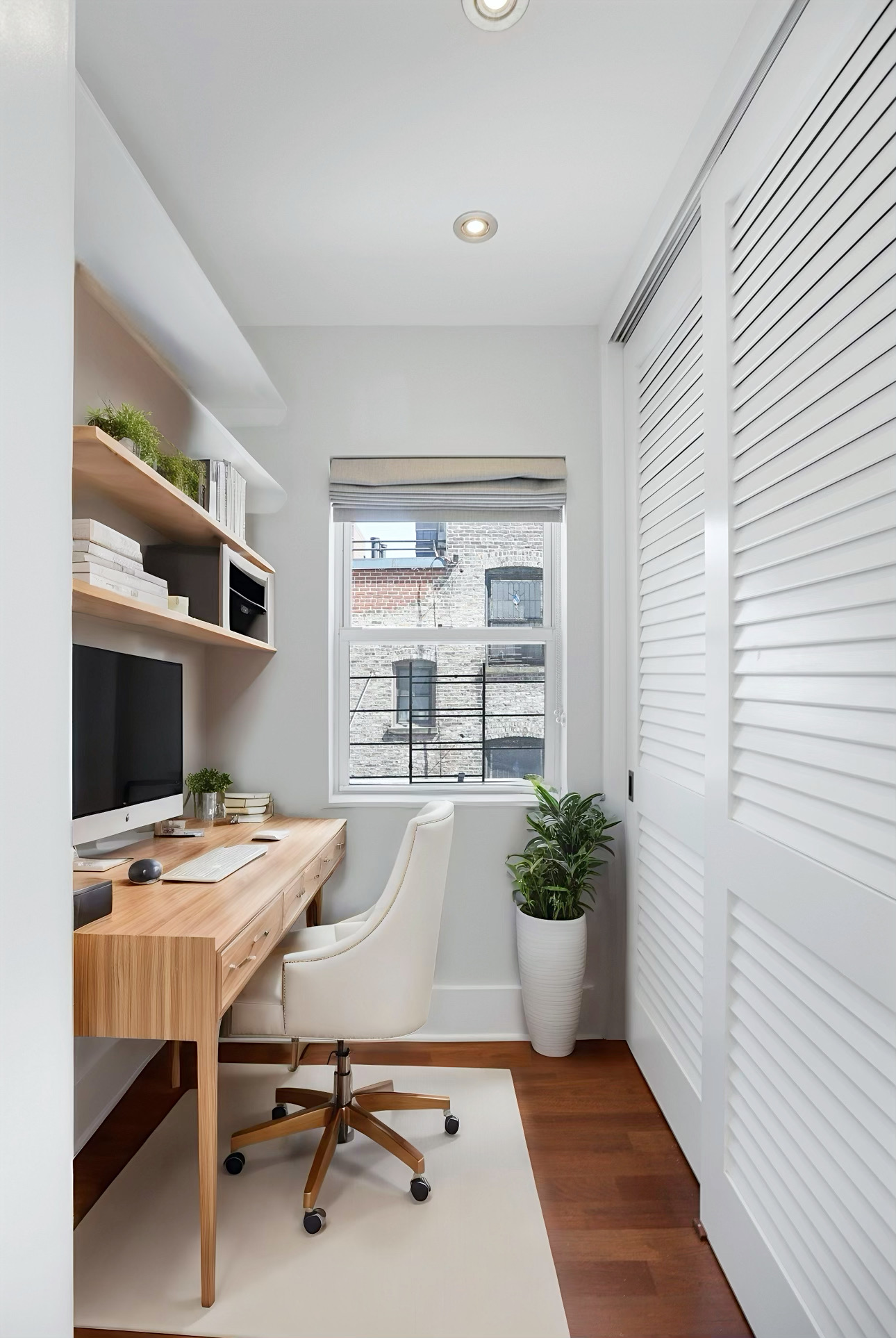 133 East 30th Street, Unit PH5B Manhattan, NY 10016 - Photo 10 of 24 a workspace with furniture and a window