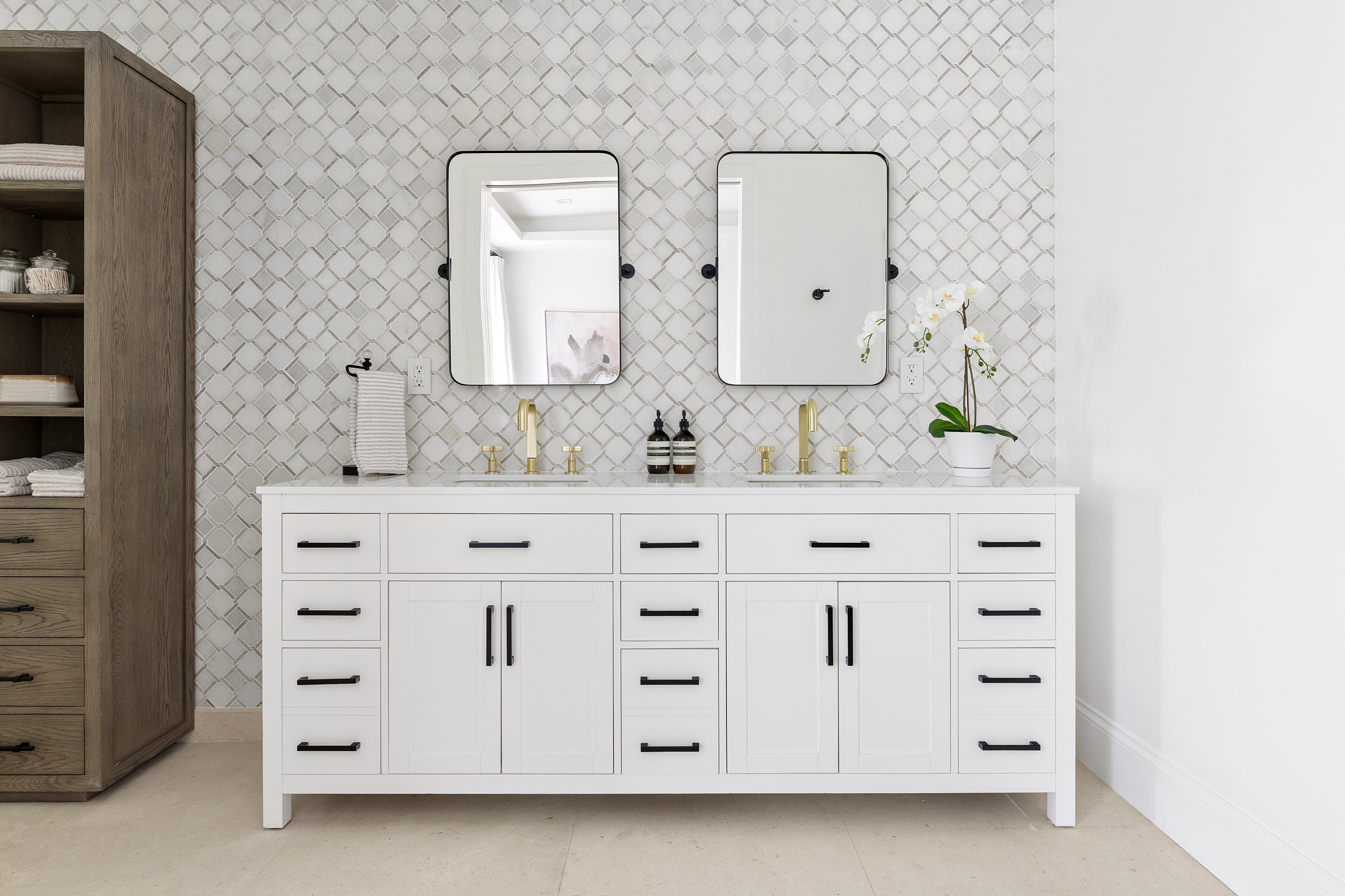 25 East 94th Street Manhattan, NY 10128 - Photo 13 of 33 a bathroom with a double vanity sink and mirror