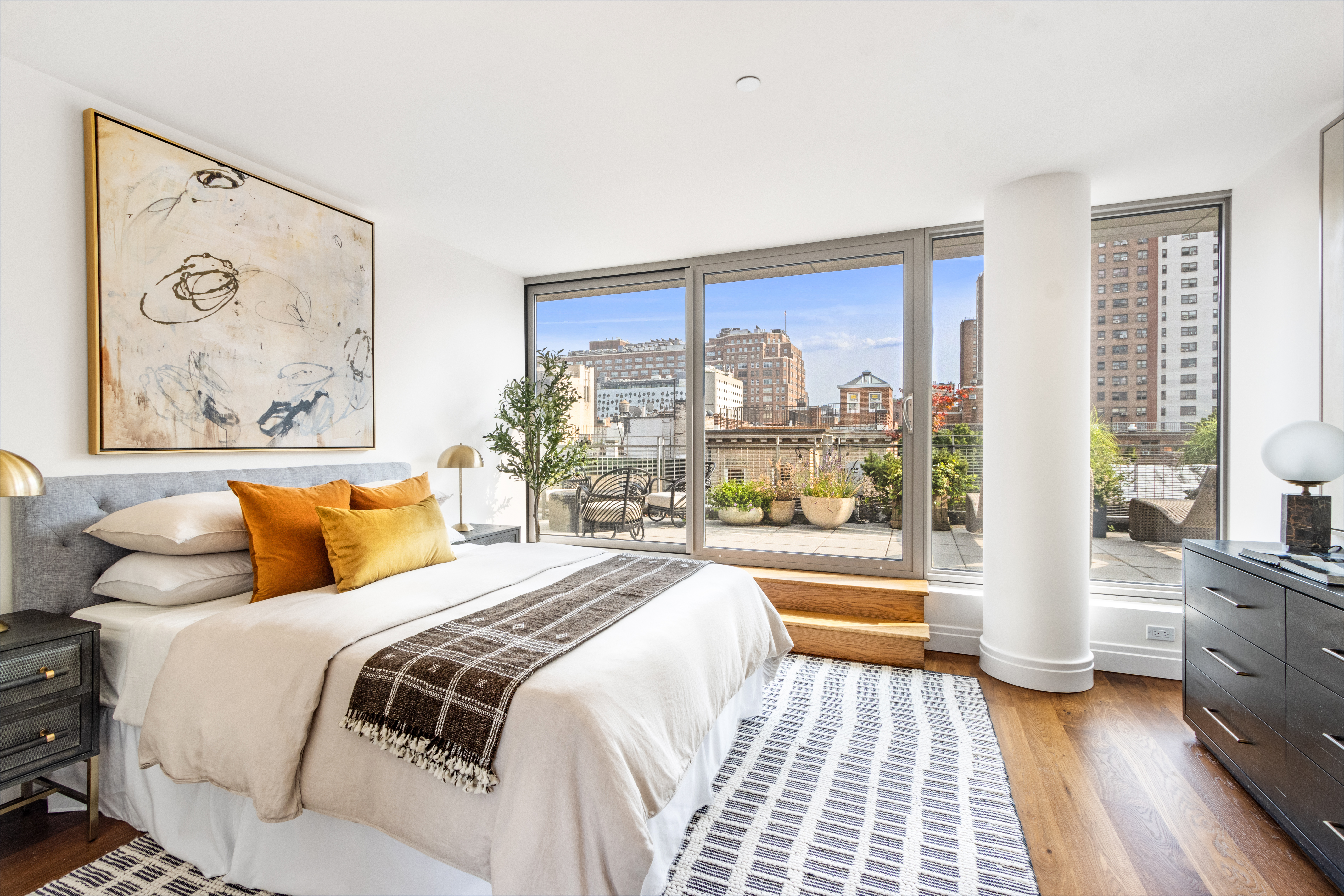 177 9th Avenue, Unit PHA Manhattan, NY 10011 - Photo 13 of 28 a bedroom with a bed and a large window