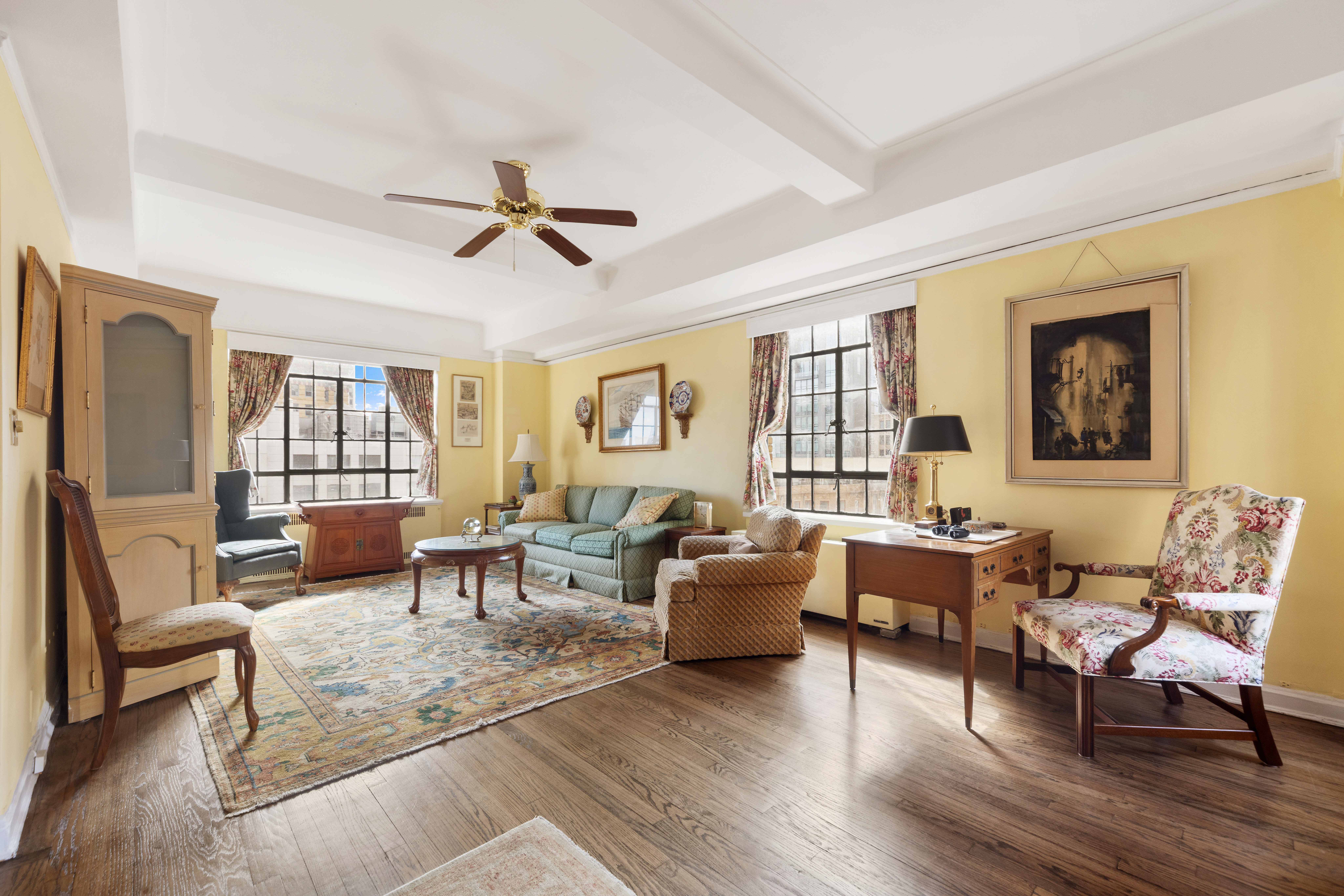 10 Park Avenue, Unit 26A Manhattan, NY 10016 - Photo 1 of 10 a living room with furniture and wooden floor