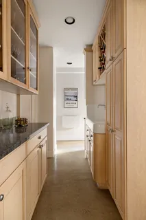 a kitchen with a refrigerator and a sink