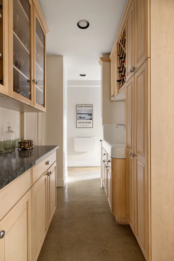 a kitchen with a refrigerator and a sink