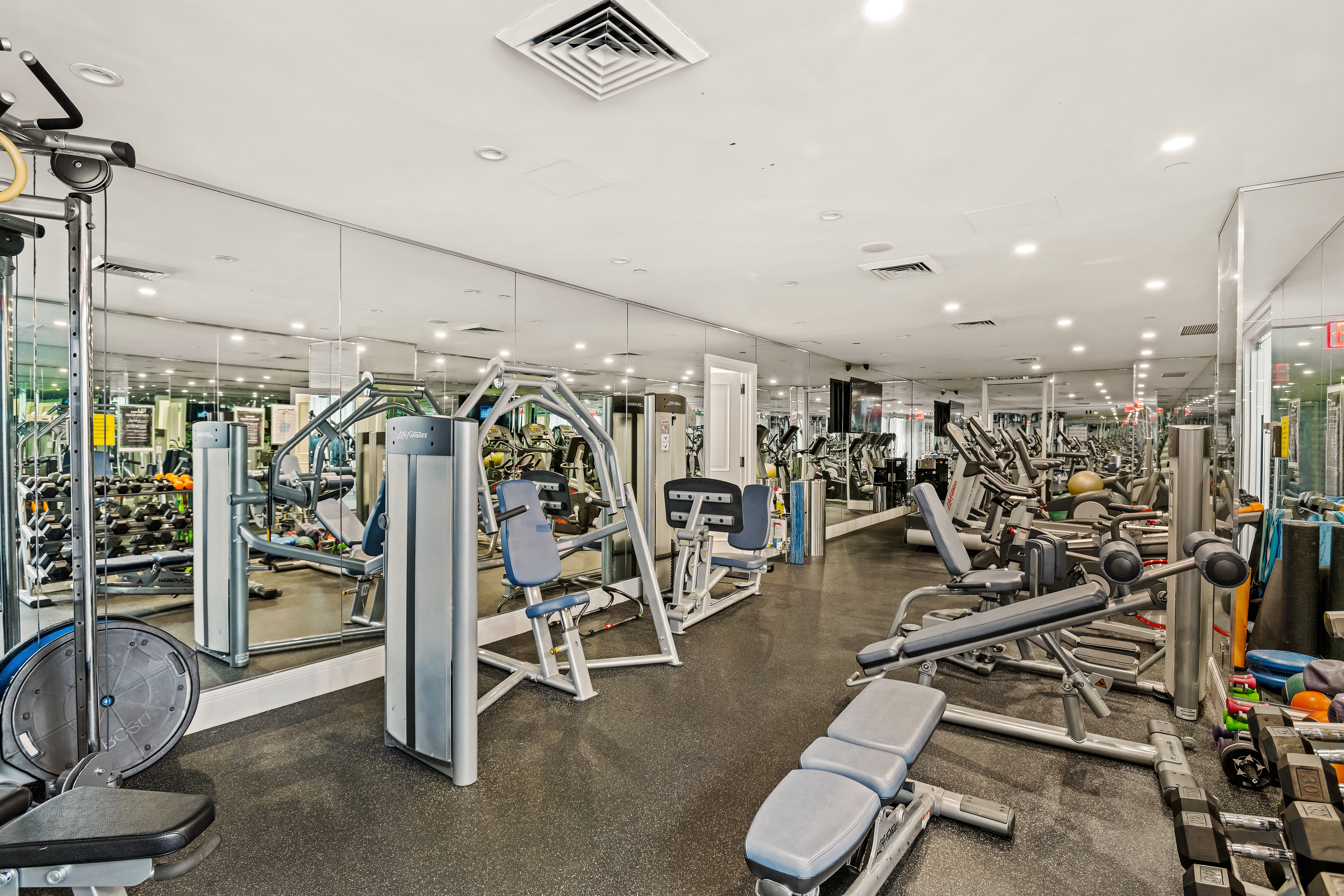 351 East 51st Street, Unit PH7A Manhattan, NY 10022 - Photo 9 of 14 a view of a room with gym equipment