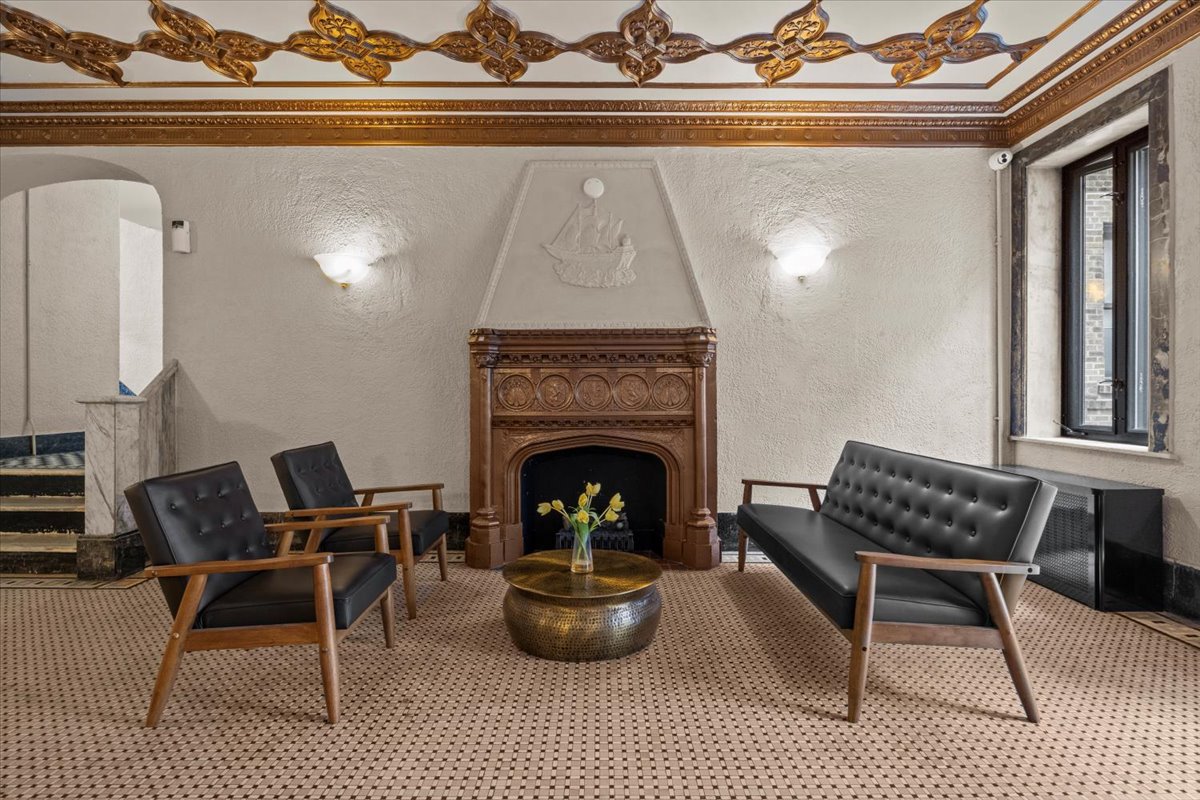 7101 Colonial Road, Unit R3E Brooklyn, NY 11209 - Photo 12 of 19 a living room with furniture and a fireplace