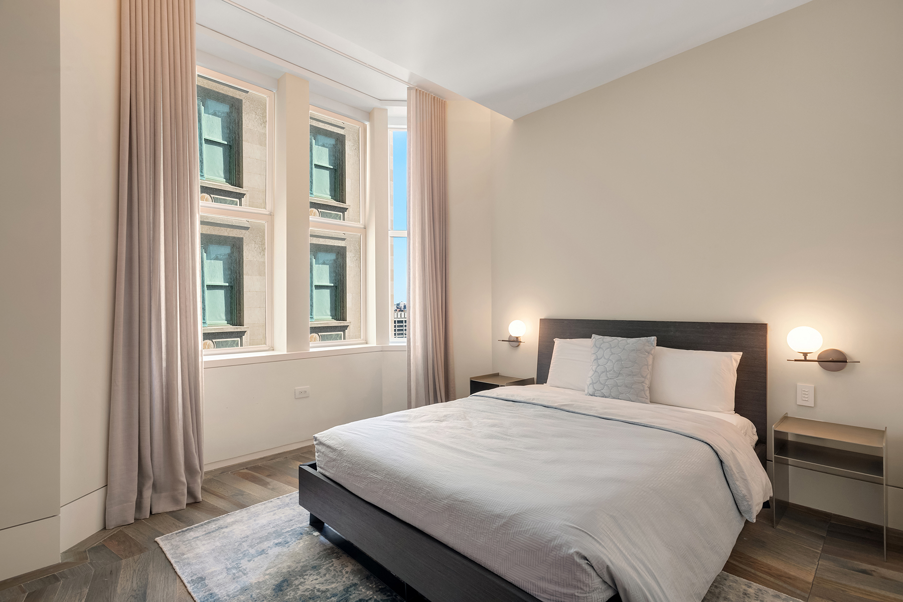 49 Chambers Street, Unit 11D Manhattan, NY 10007 - Photo 11 of 30 a bedroom with a bed and a window