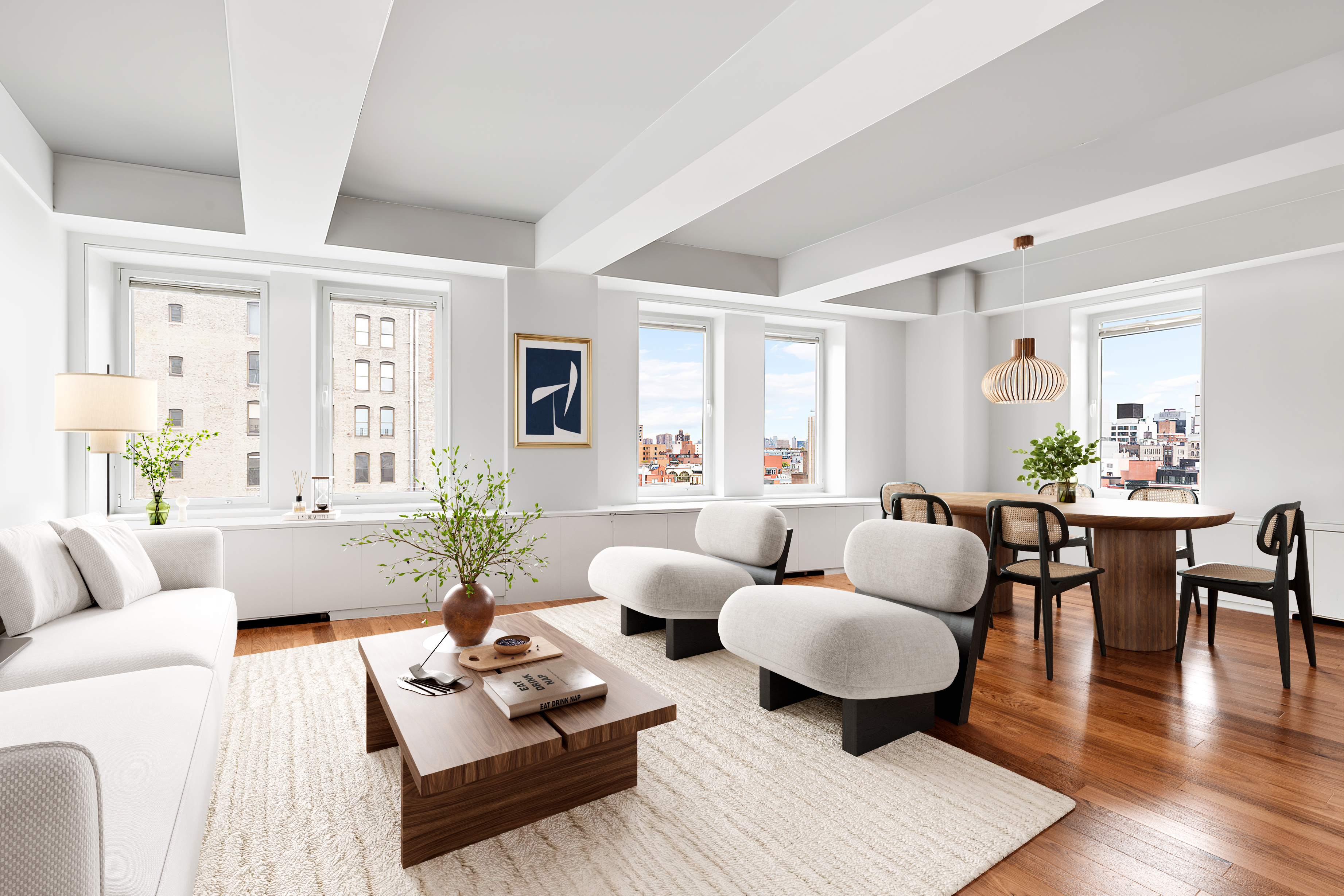 a living room with furniture and wooden floor