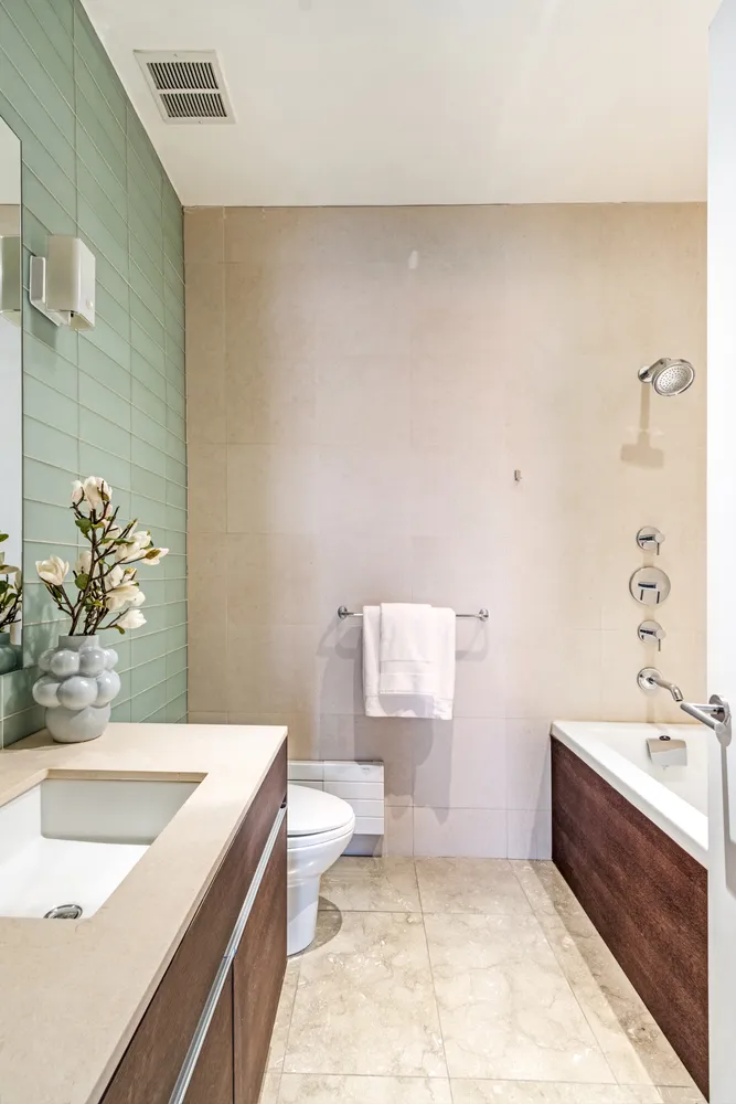 a bath room with a sink and a toilet
