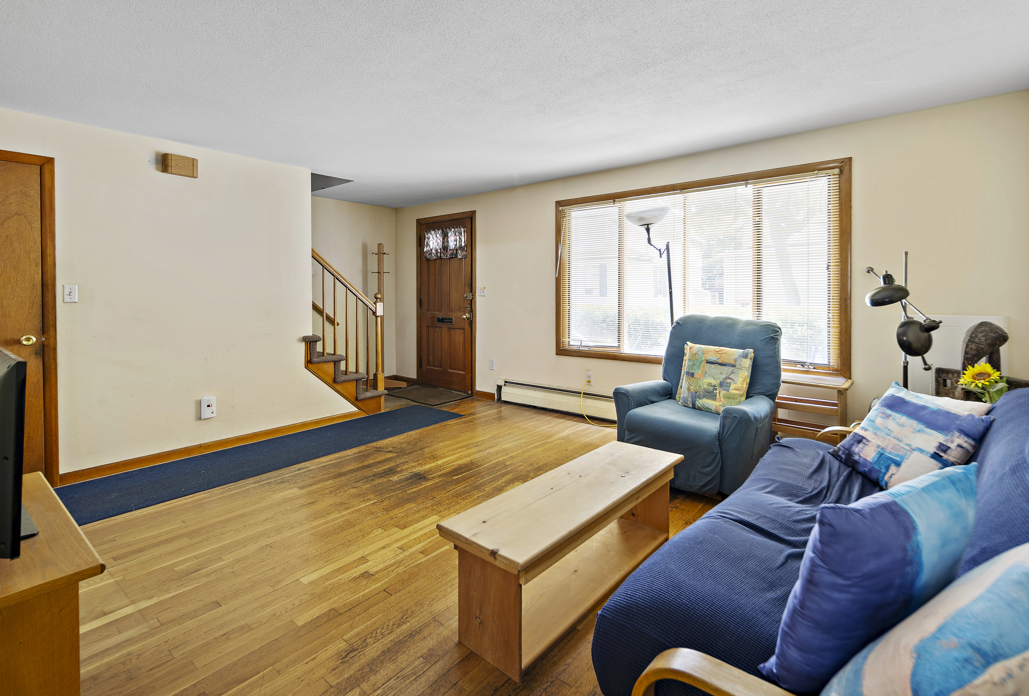 15 Harrington Road Cambridge, MA 02140 - Photo 2 of 17 a living room with furniture and a window