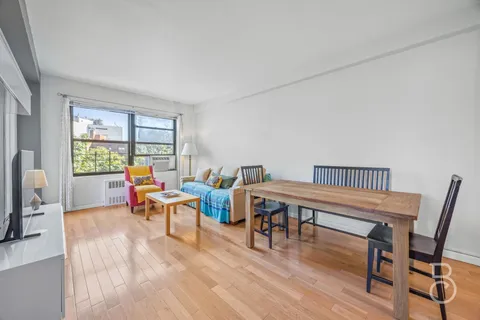 a workspace with furniture hardwood and a window