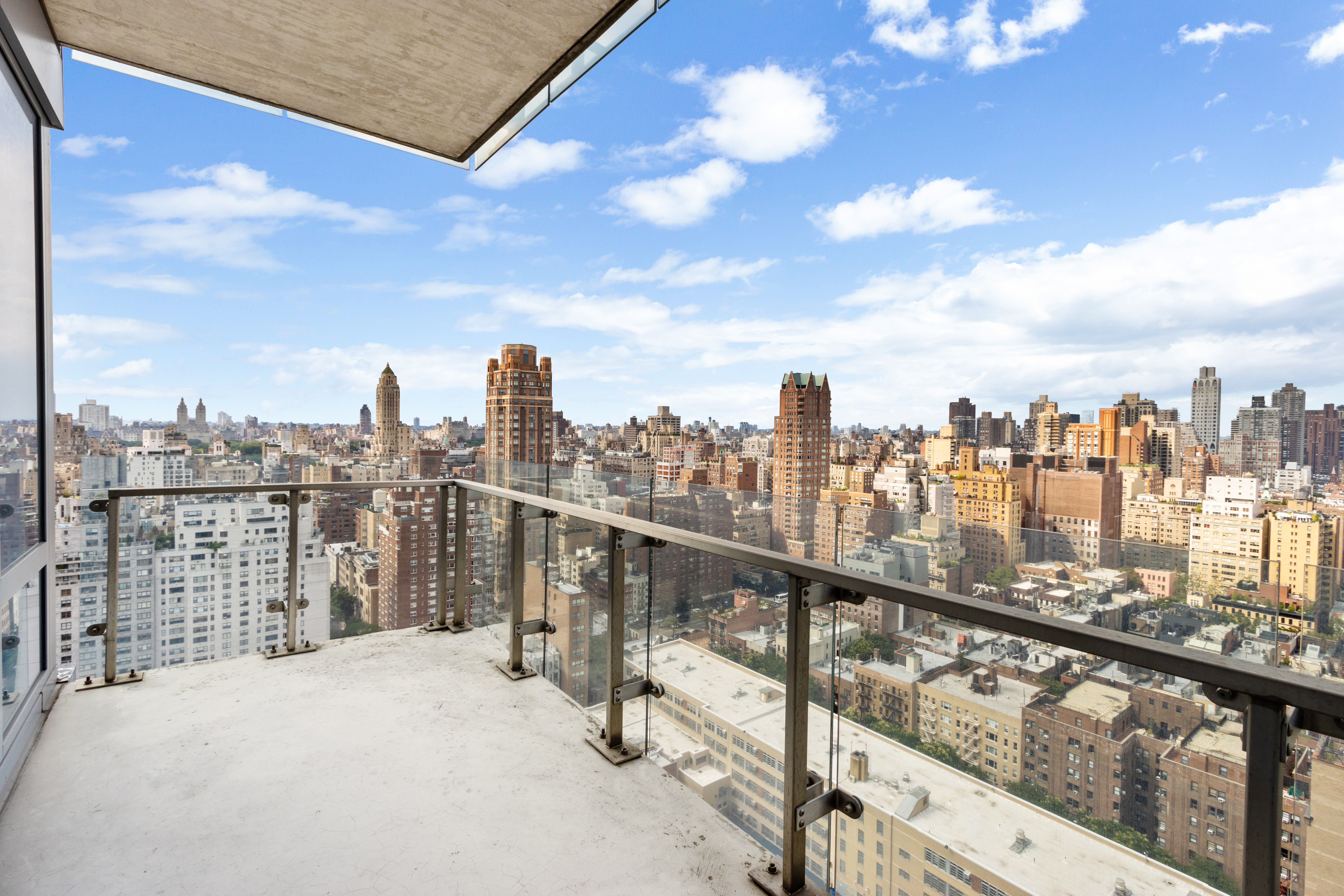 255 East 74th Street, Unit 25B Manhattan, NY 10021 - Photo 5 of 23 a view of a city skyline from a terrace