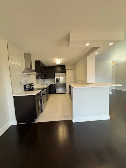 a kitchen with stainless steel appliances a refrigerator and a sink
