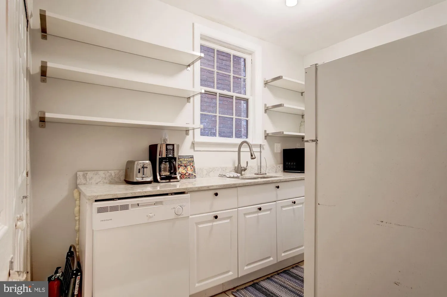 a en suite bathroom with a sink a mirror and a shower