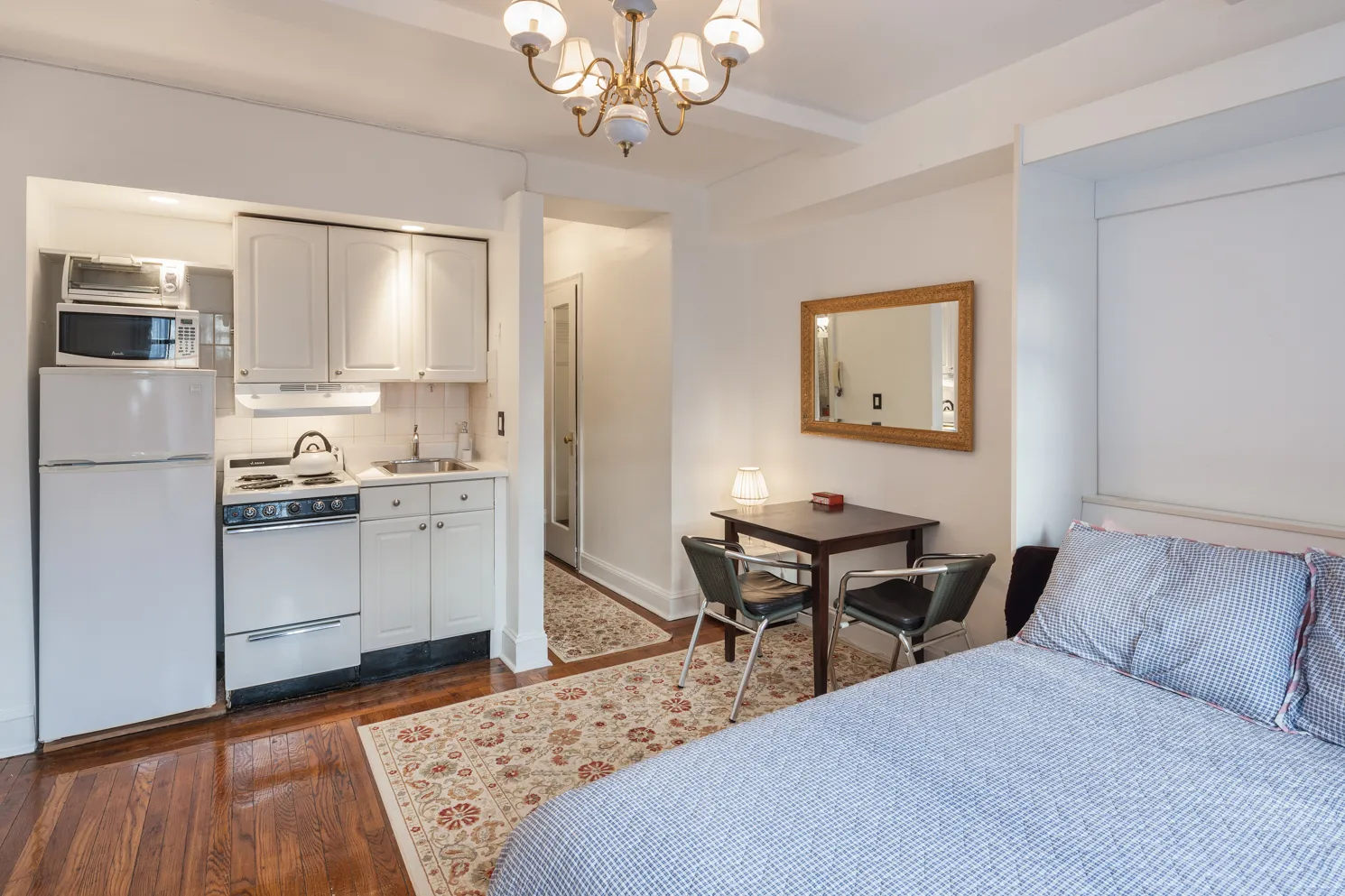 a living room with stainless steel appliances kitchen island granite countertop furniture and a kitchen view