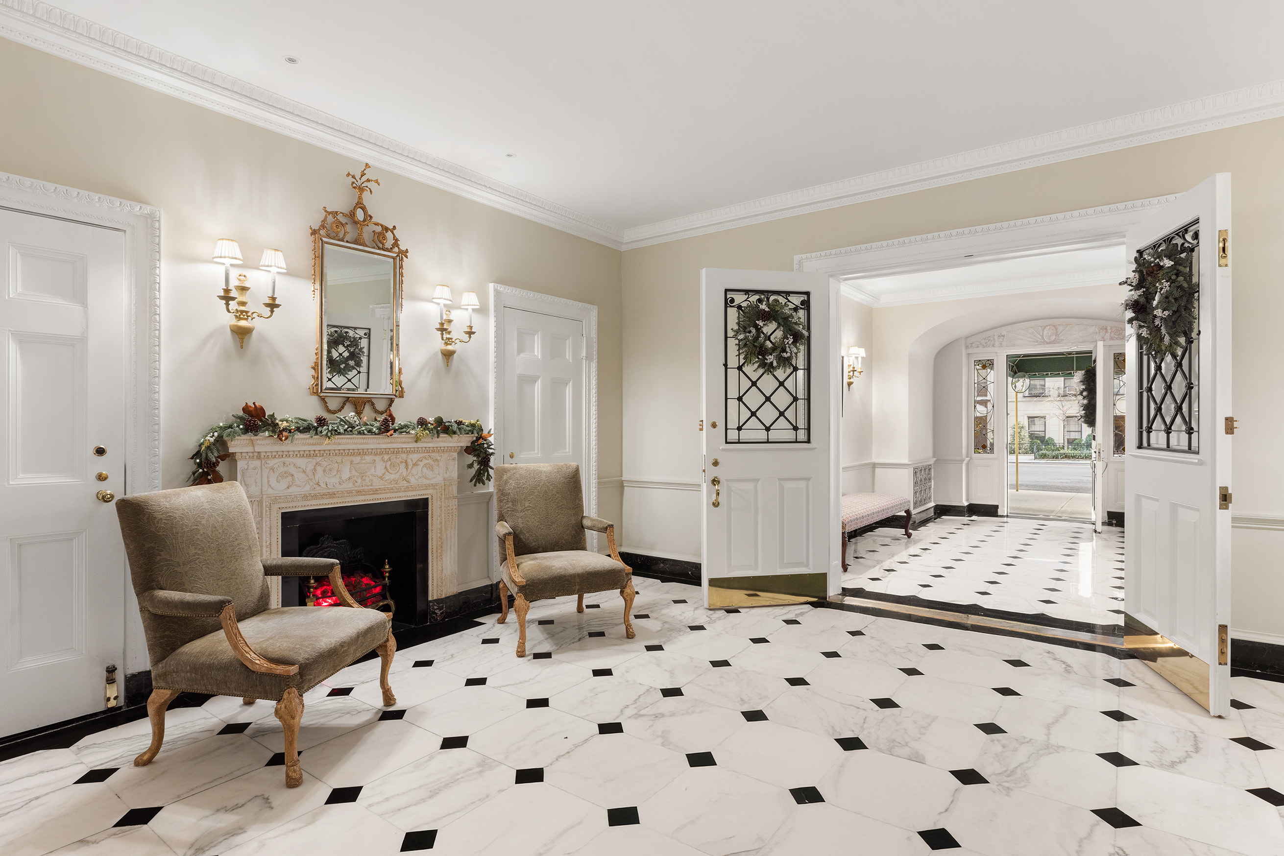 447 East 57th Street, Unit 14 Manhattan, NY 10022 - Photo 17 of 26 a bedroom with furniture and a fireplace