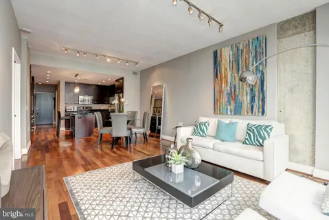 a living room with furniture and a rug