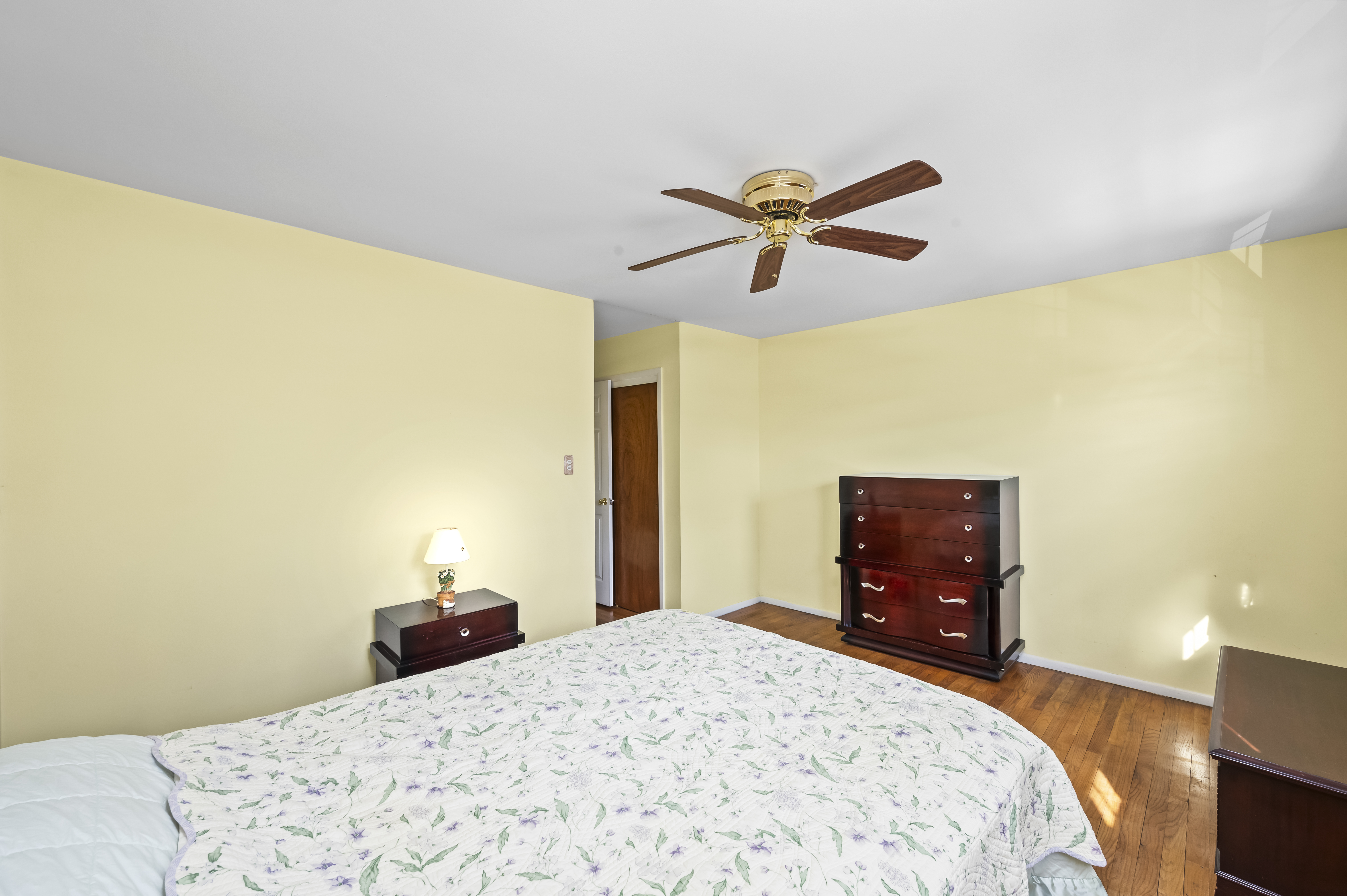 15 Area Place Staten Island, NY 10314 - Photo 18 of 27 a bedroom with a bed and a chandelier