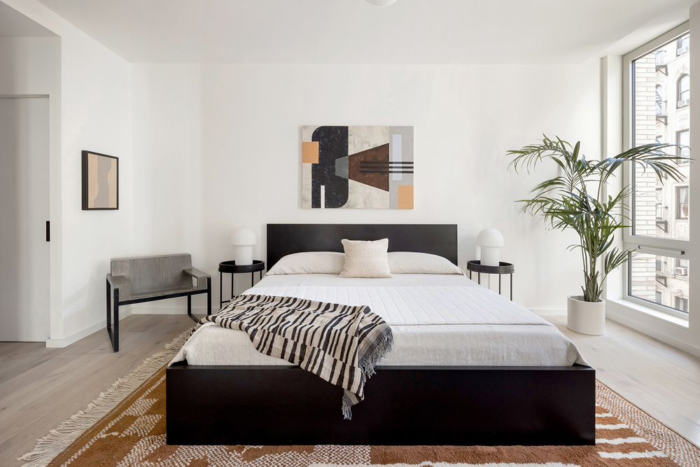 66 Clinton Street, Unit 6A Manhattan, NY 10002 - Photo 8 of 17 a bedroom with a bed and wooden floor