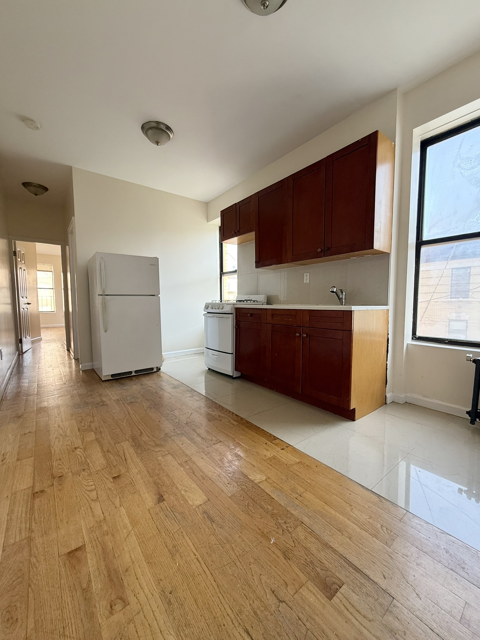 196 West 108th Street, Unit 5N Manhattan, NY 10025 - Photo 1 of 5 a living room with a couch and a flat screen tv