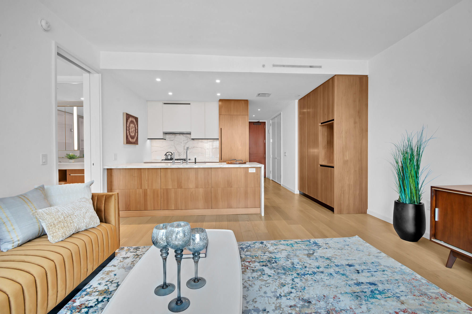 1 West End Avenue, Unit 16L Manhattan, NY 10069 - Photo 2 of 11 a living room with furniture and potted plant