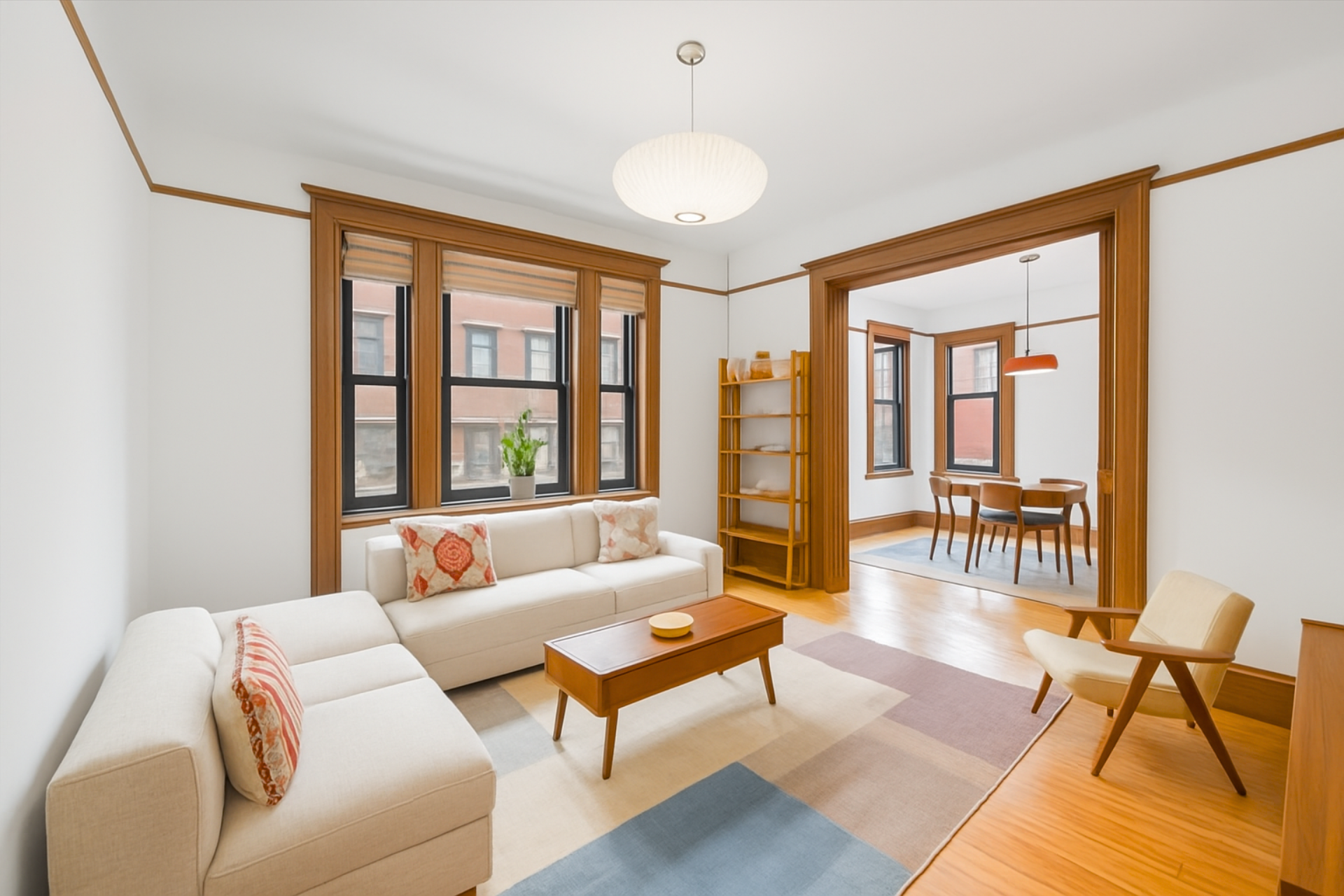 605 West 111th Street, Unit 43 Manhattan, NY 10025 - Photo 2 of 21 a living room with furniture and a large window