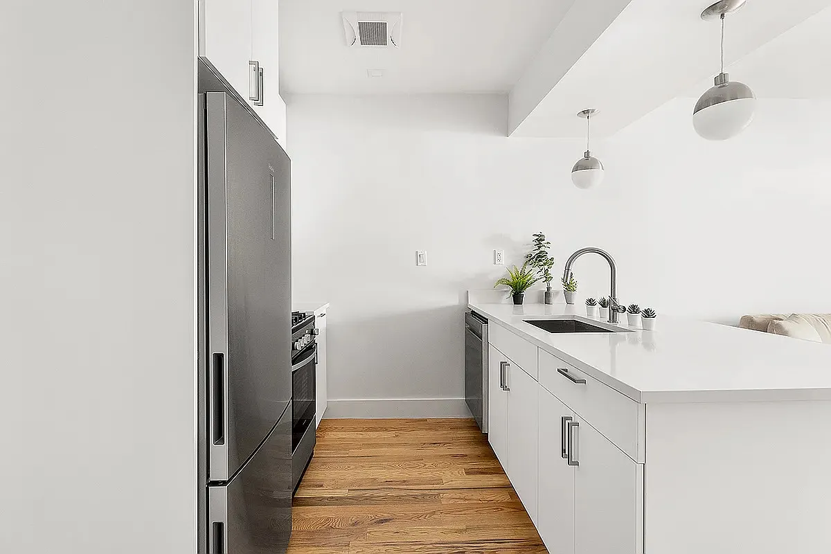 53 3rd Street, Unit 1R Brooklyn, NY 11231 - Photo 3 of 6 a hallway with sink and view of living room